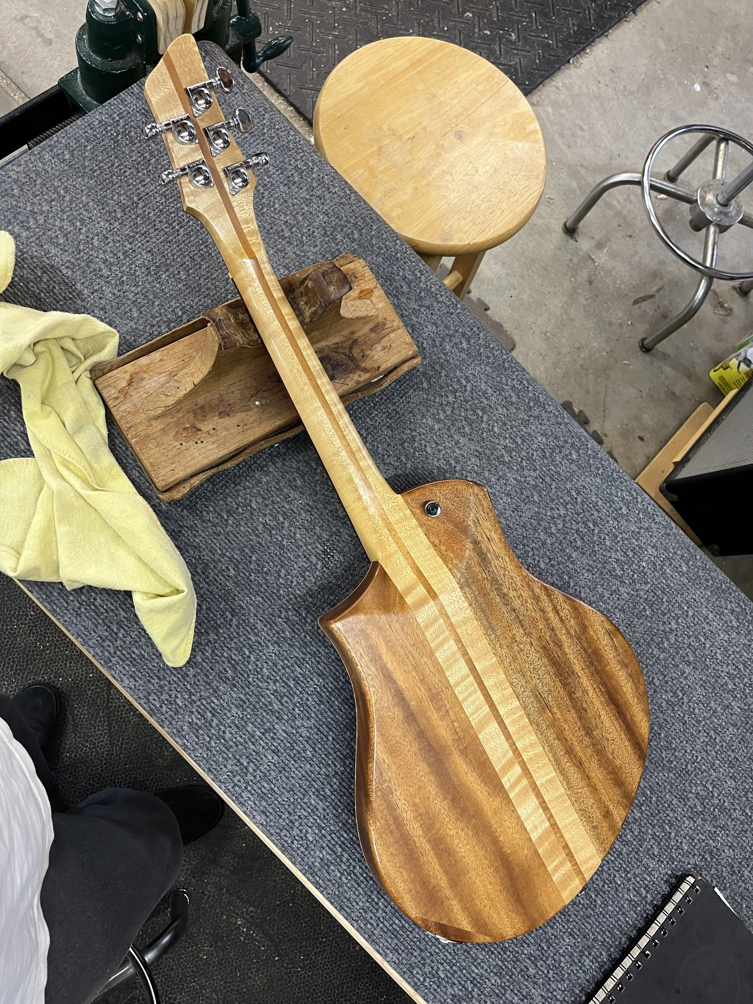 Mann Raven-Mandolin/Mandola lying on luthier's bench, back view.