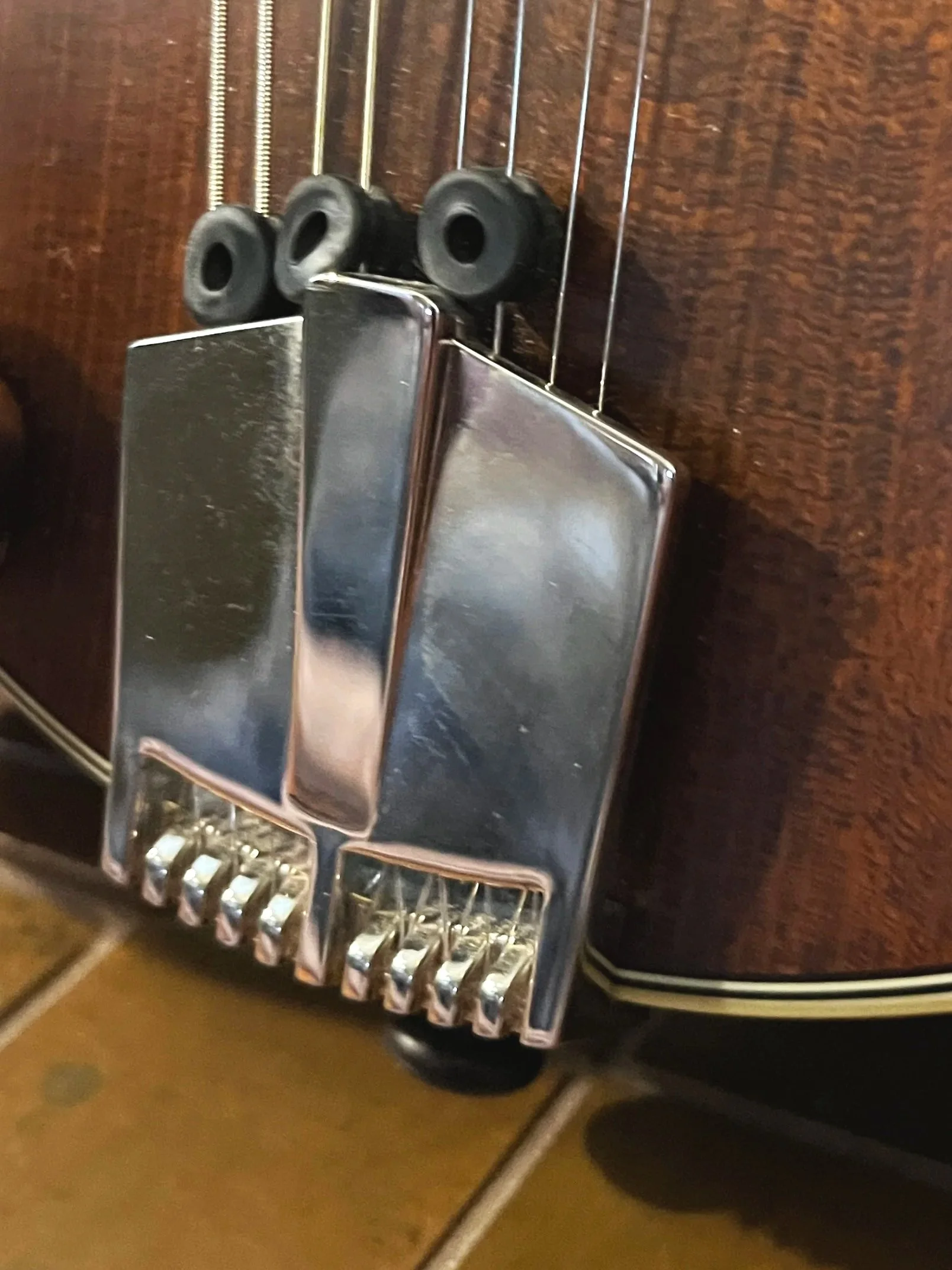 Eastman 715 Mandolin detail view of tailpiece. (2024, #6 of 15, original run)