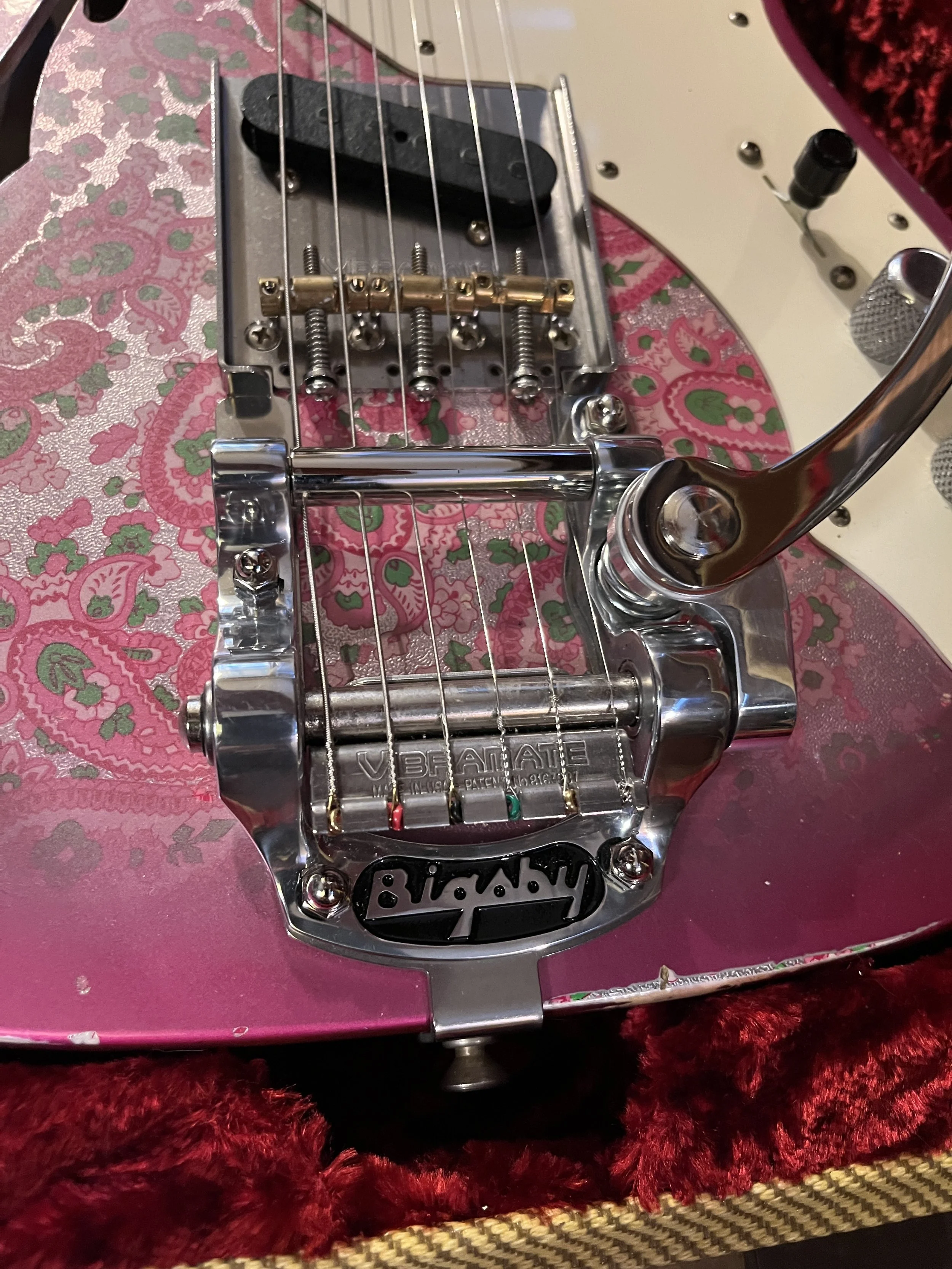 Closeup of the Bigsby tailpiece/tremolo/vibrato added to a reliced pink paisley Fender Telecaster Thinline 50s.