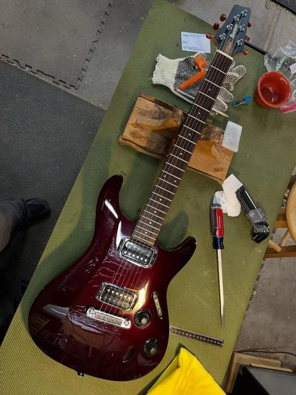 Ibanez S-Series electric guitar in burgundy on the Two Moons Lutherie workbench before a setup.