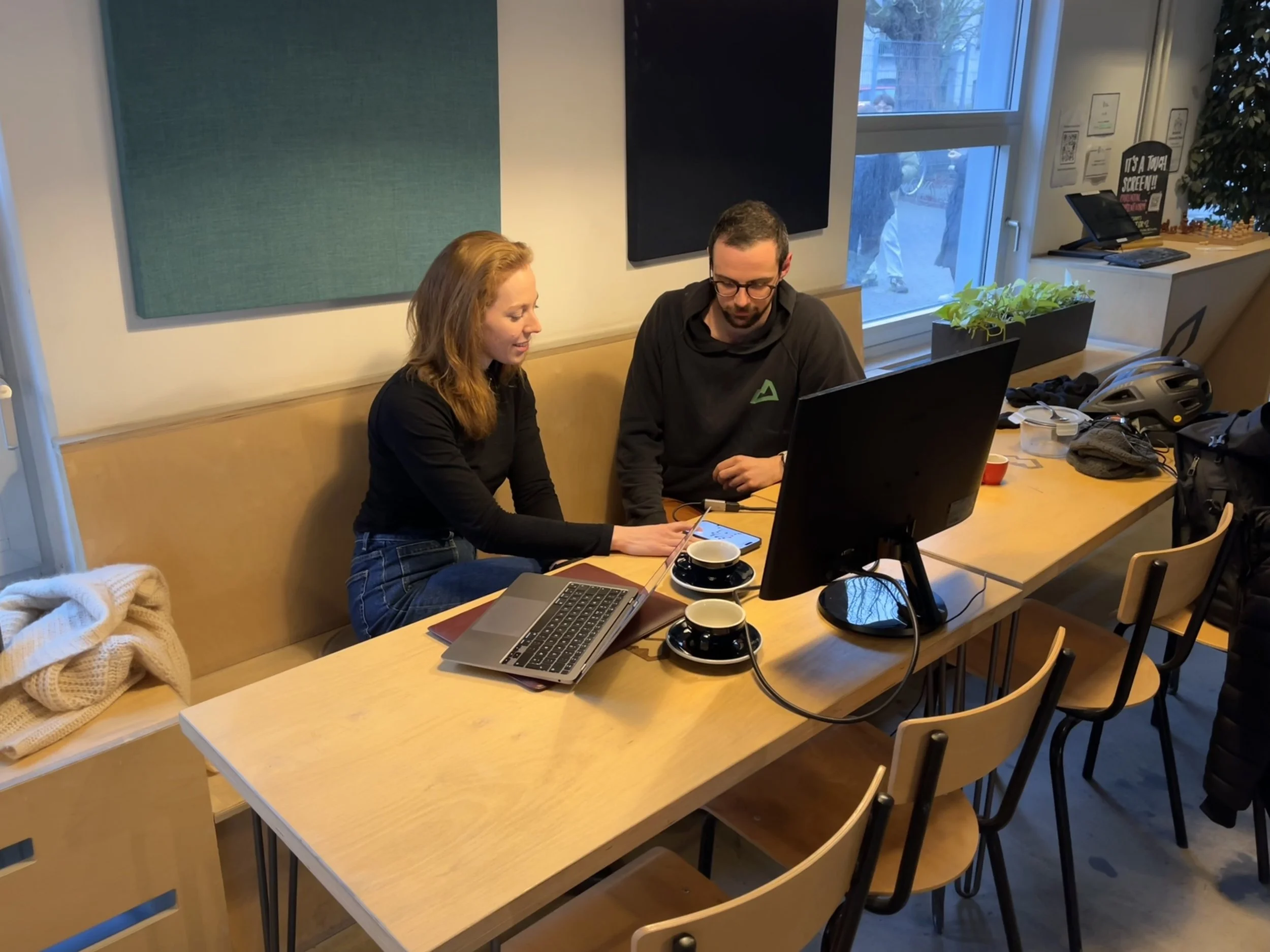 An image showing me interviewing and testing with a route setter at a climbing gym.