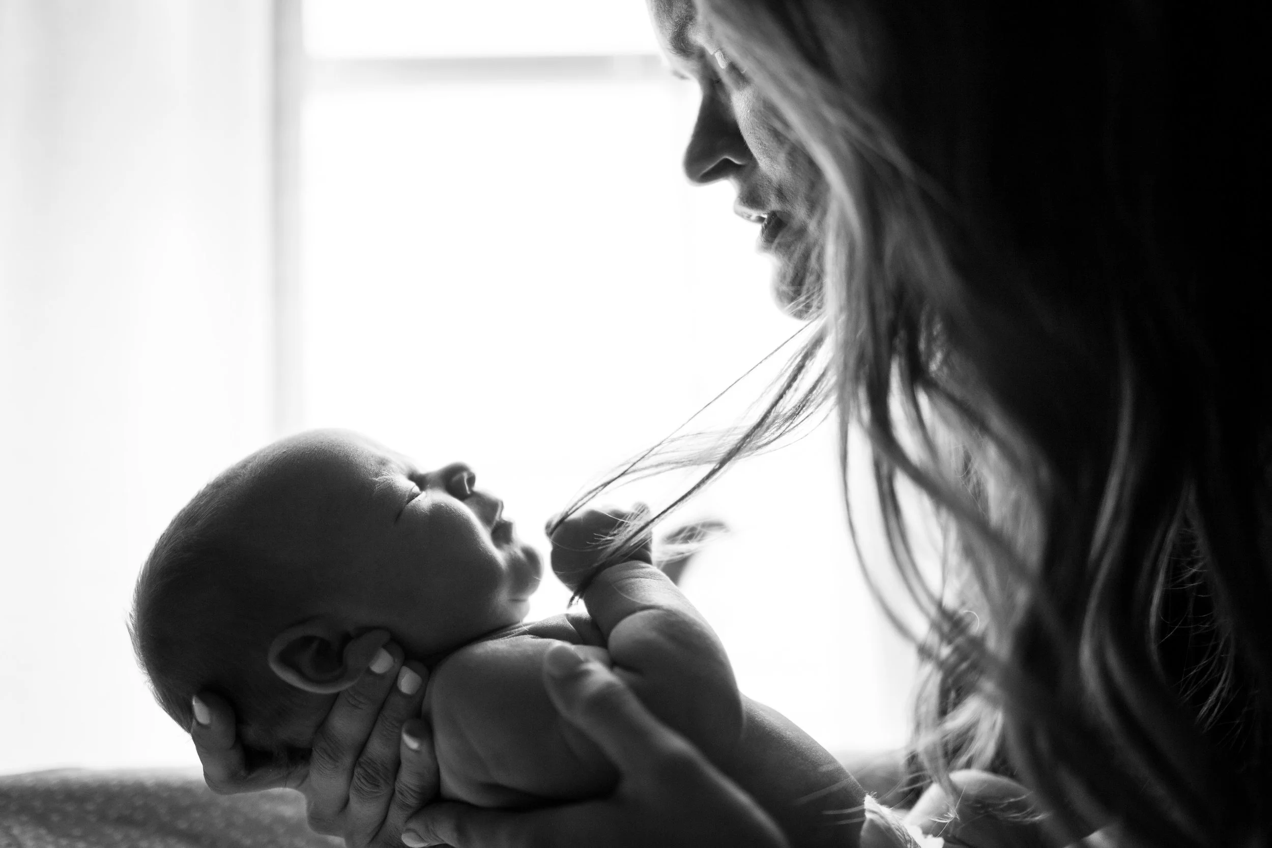 Woman holding newborn baby