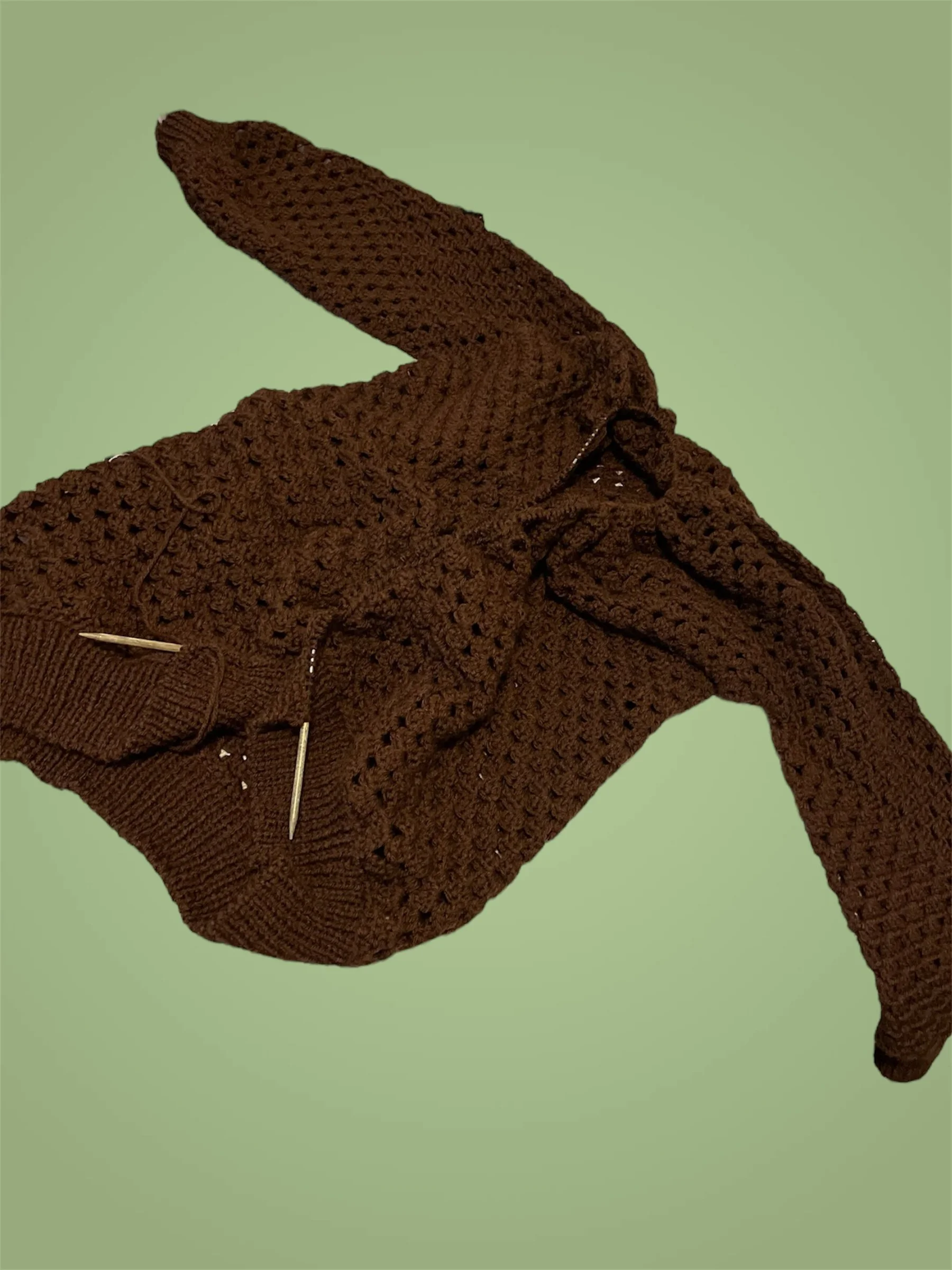 Once the body length was added, I picked up and knit the bottom hem, and once that was cast off, I picked up around the entire collar and knit about 2 inches of ribbing, the bind off took hours.