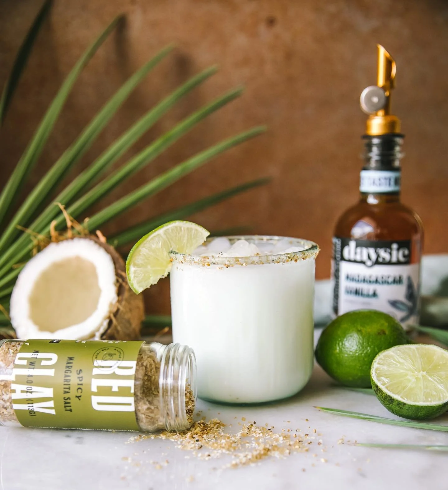 The drink of the summer is this spicy coconut margarita that is a collaboration with @redclayhotsauce and @enjoydaysie I obviously had to try it when working on this project &amp; it is the perfect blend of light/creamy with a touch of spice. I also 