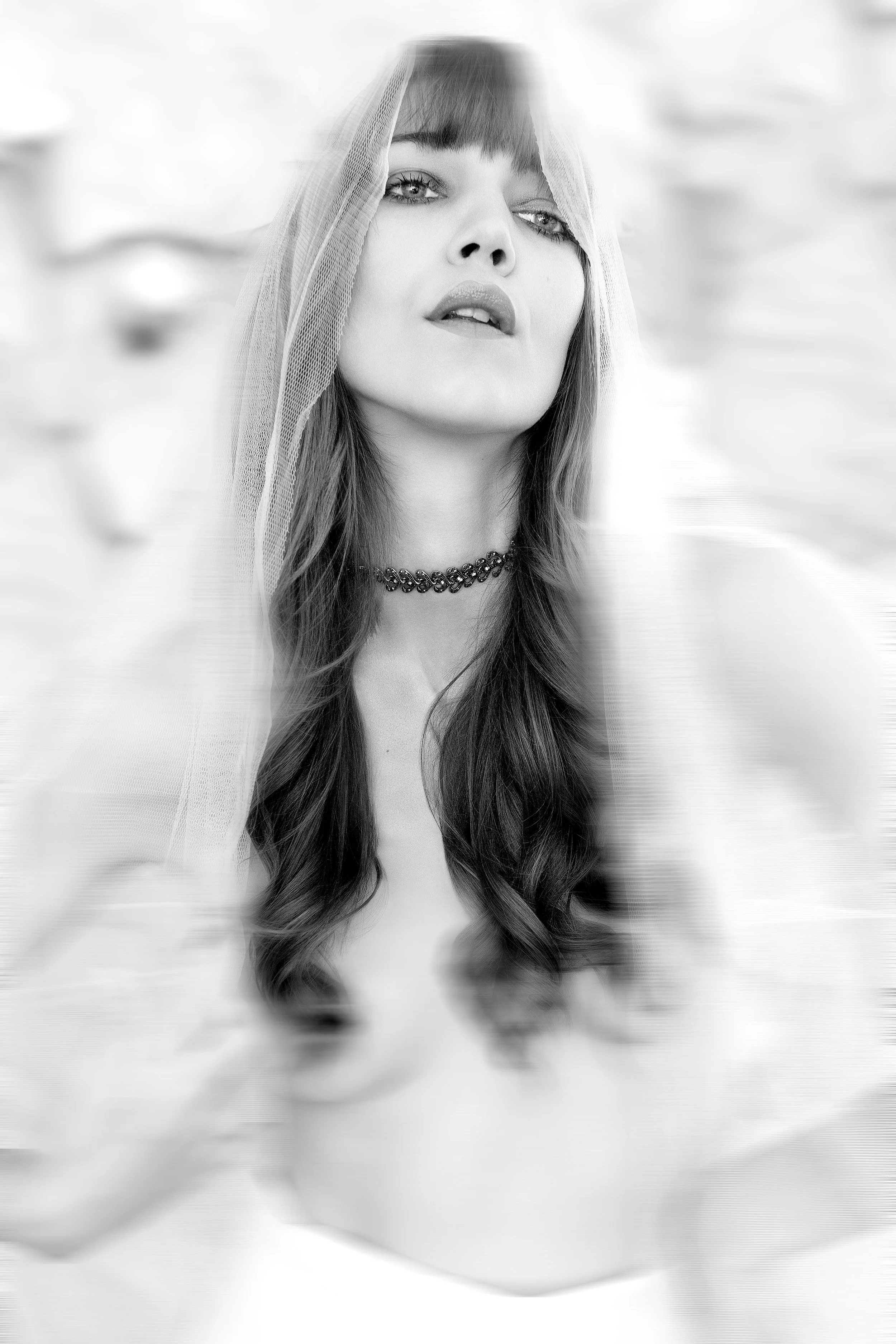 Soft self-portrait emerging through translucent fabric, exploring intuition and emotional presence