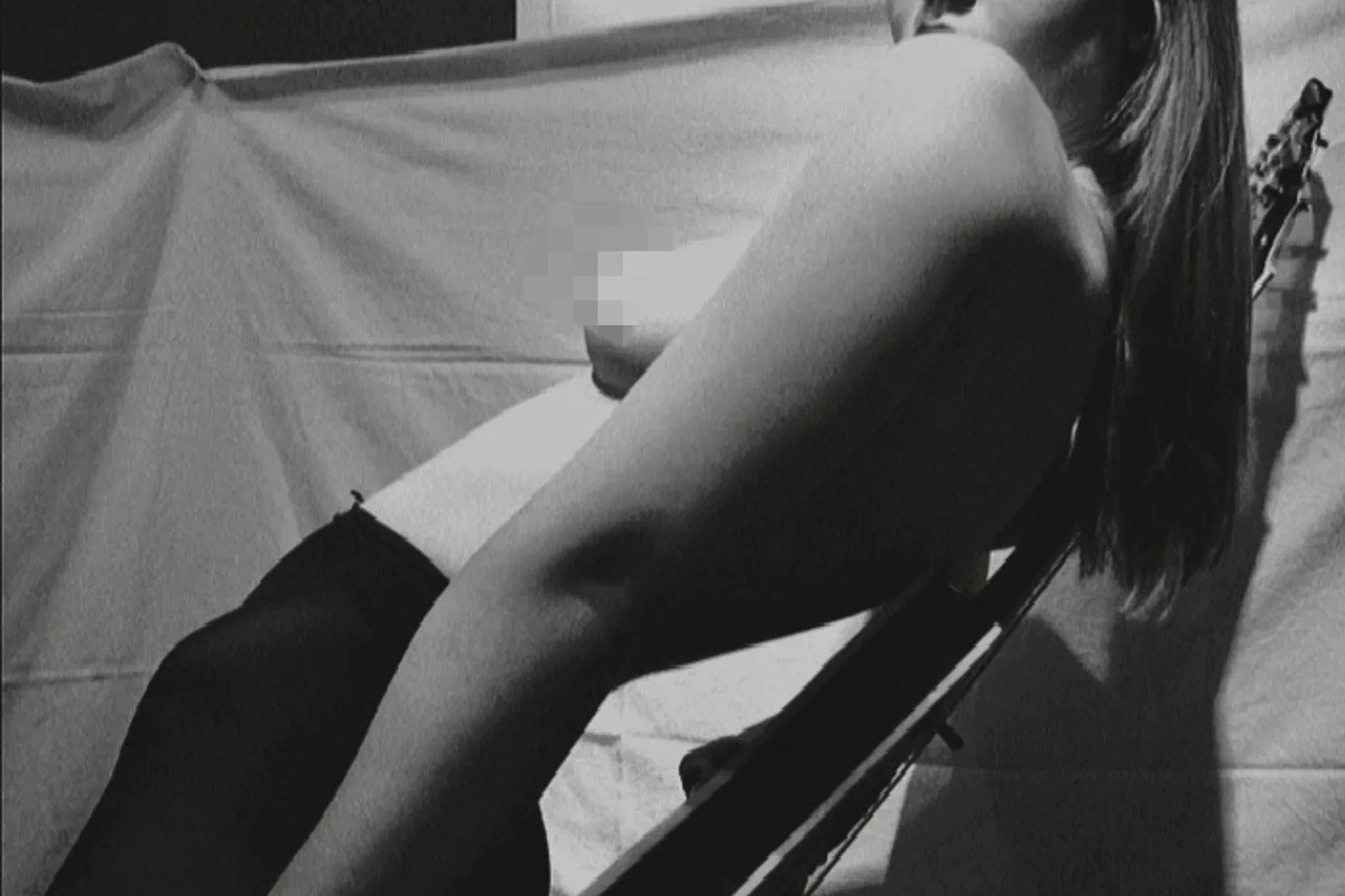 Black and white self-portrait study exploring gesture, light, and the relationship between body and space.