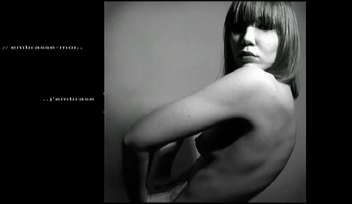 self-portrait, bare shoulders turned away from the camera, soft light and minimal composition