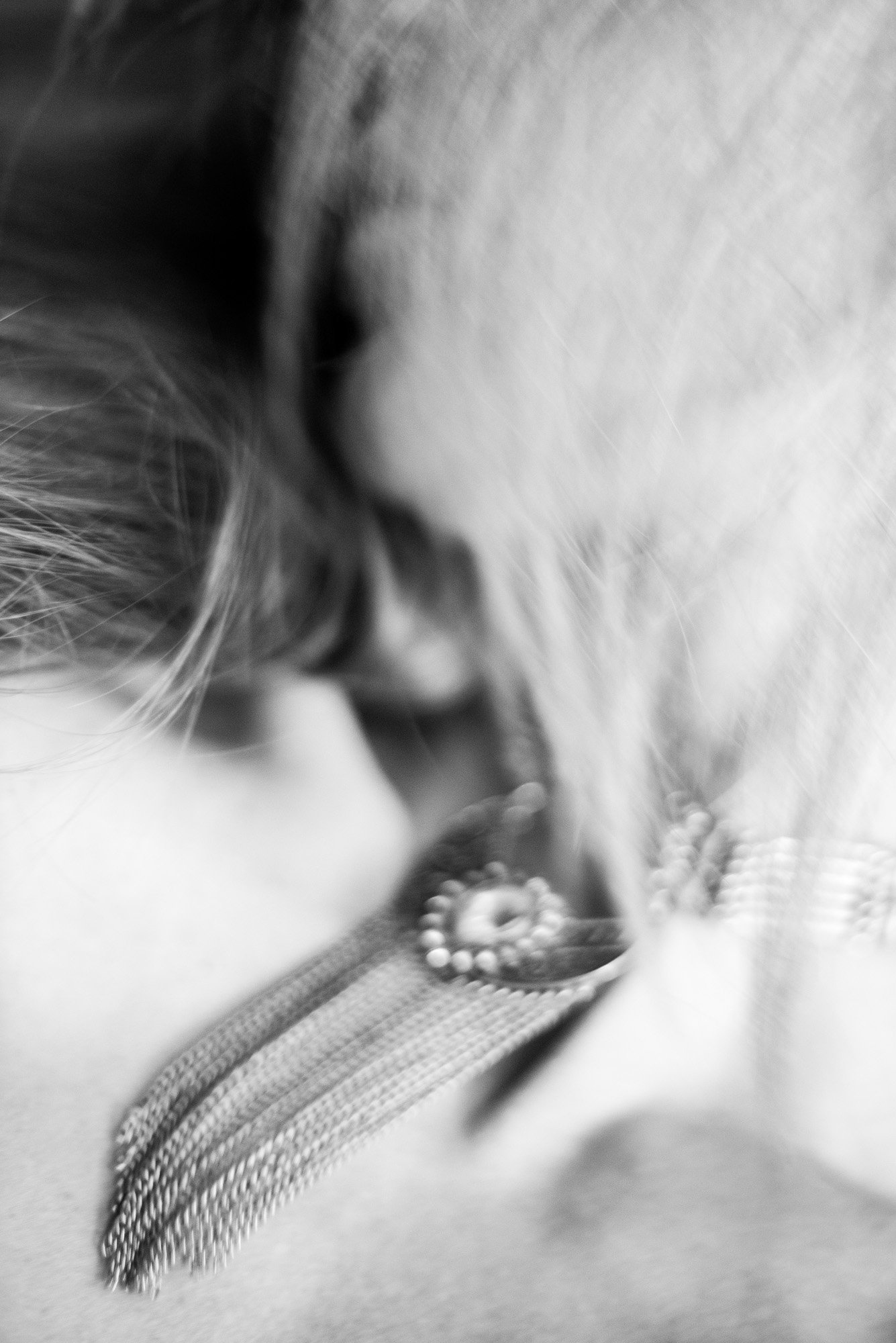 Highly abstract black-and-white portrait with blurred human form and indistinct features.