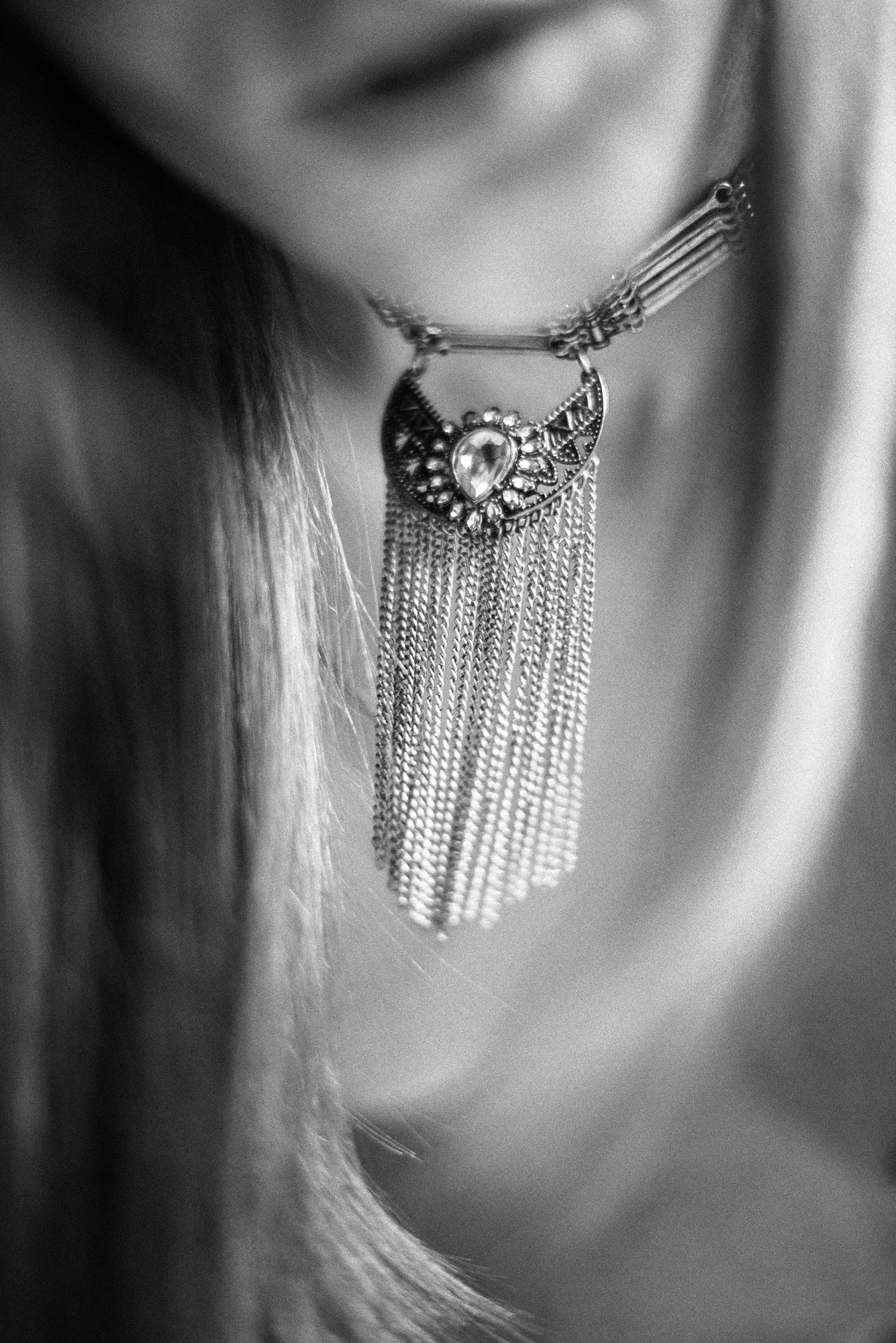 Highly abstract black-and-white portrait with blurred human form and indistinct features.