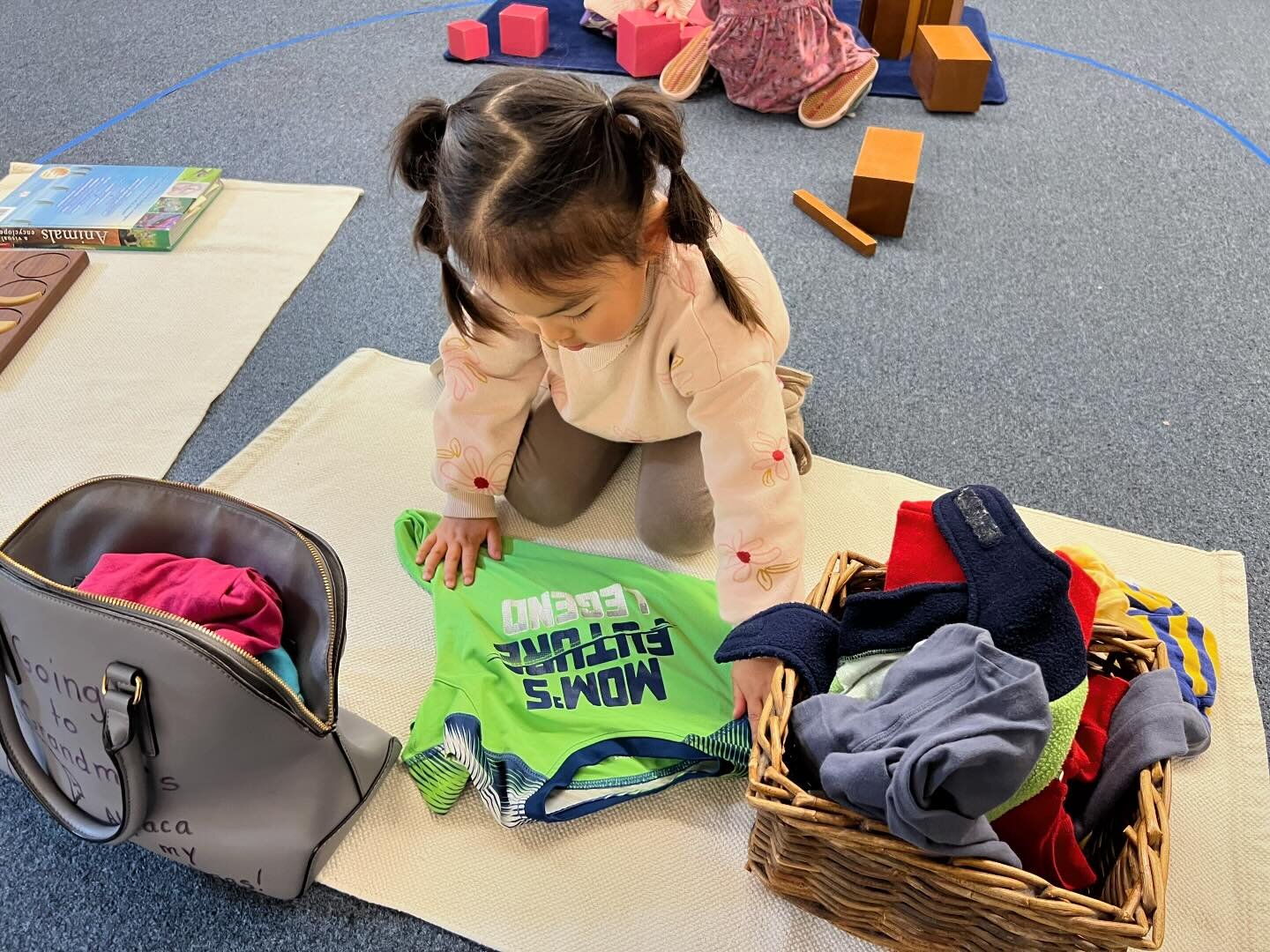 A favorite Practical Life work is packing for a trip. This child carefully folds the item before putting it in the bag.

#Montessoripreschool
#SFmontessori
#SFpreschool