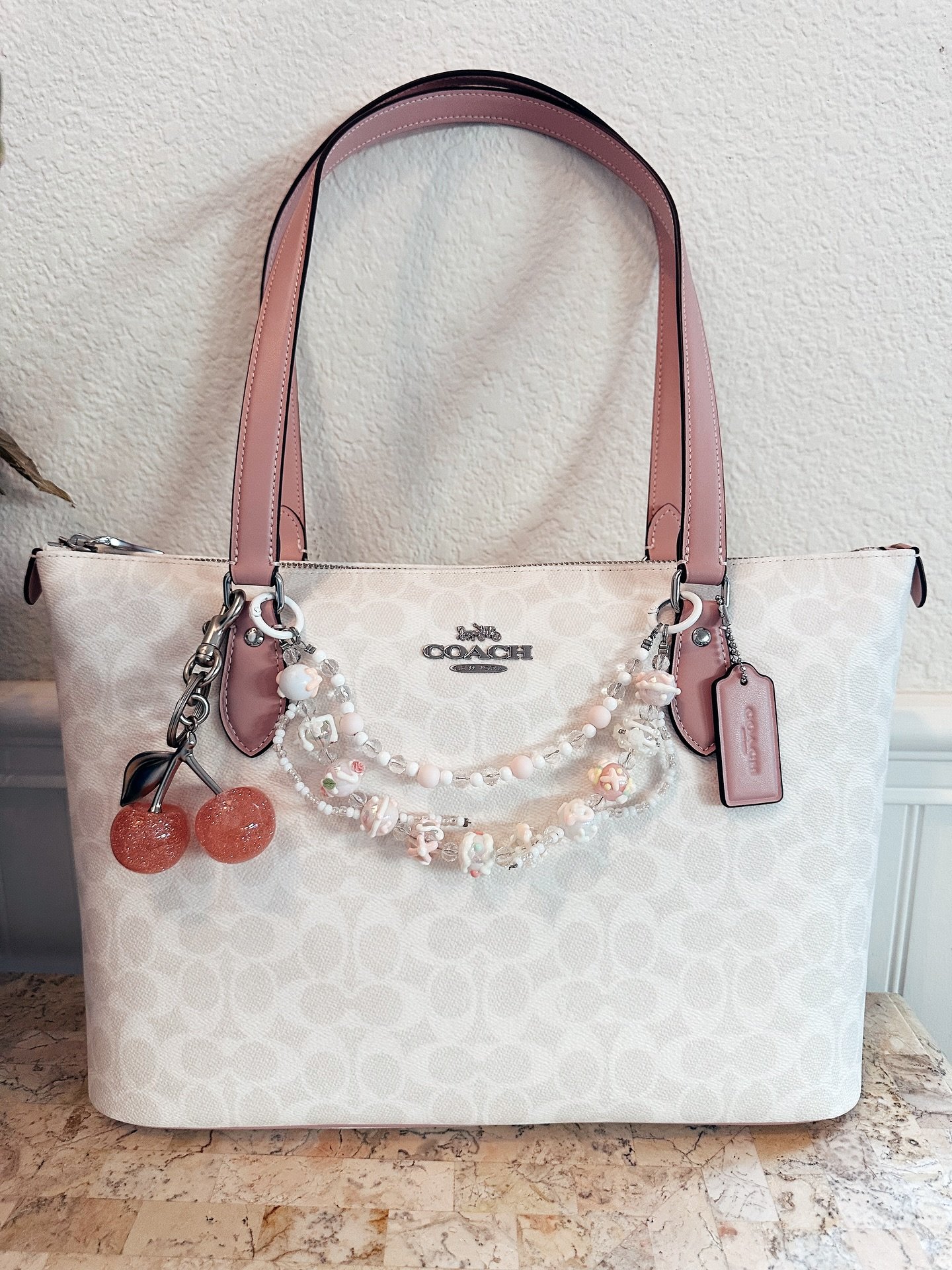 Keeping her simple for summer 🍒 #coach #coachtote #mommybag