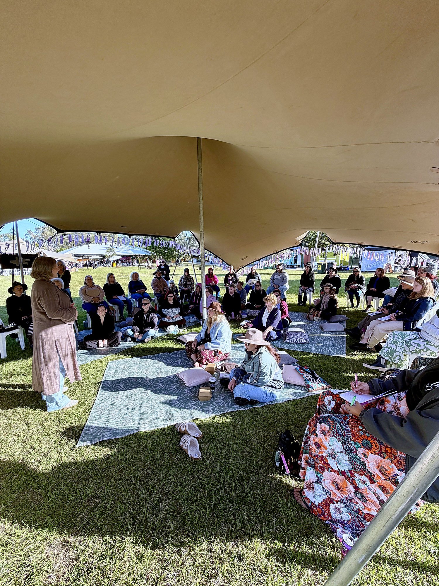 Jane Ooms presenting to a full tent at the Ultimate Girls Weekend