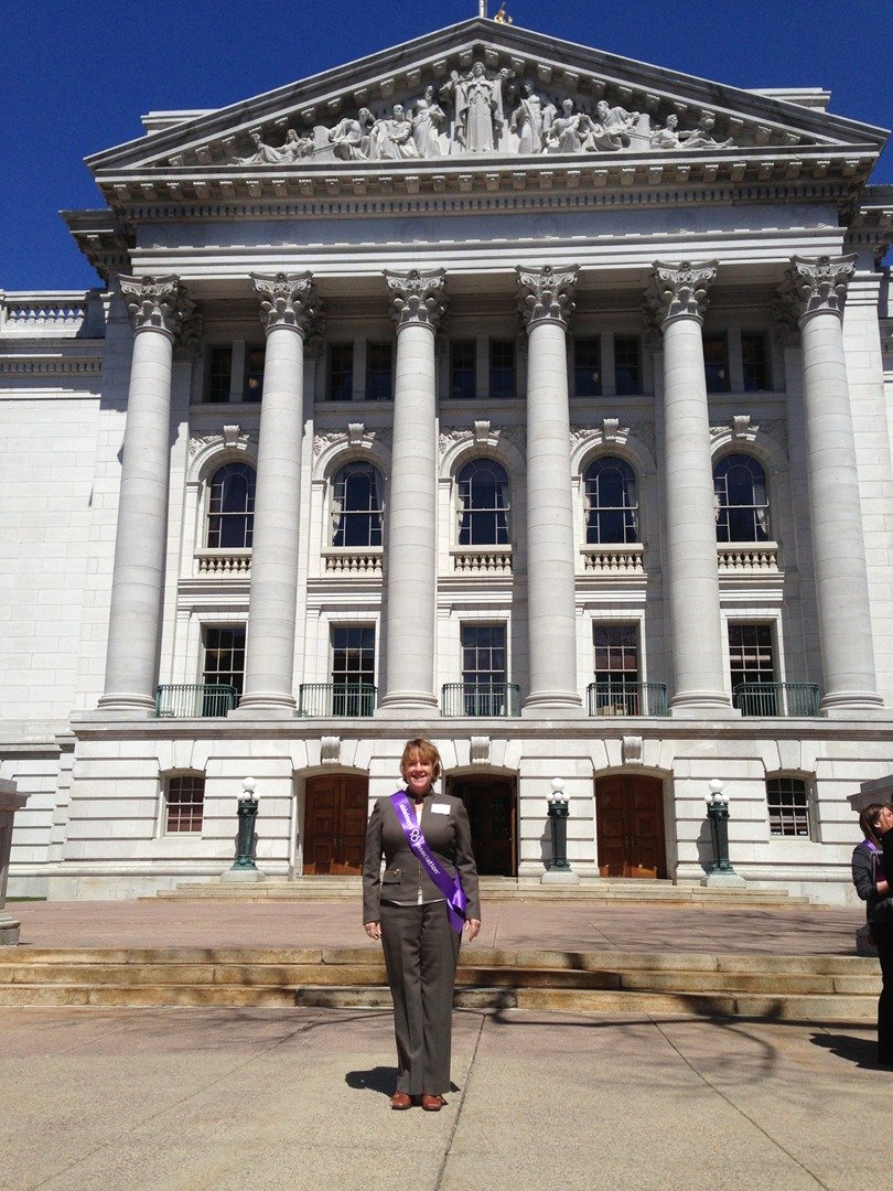 Carol Wessels standing in front of capitol building in Madison