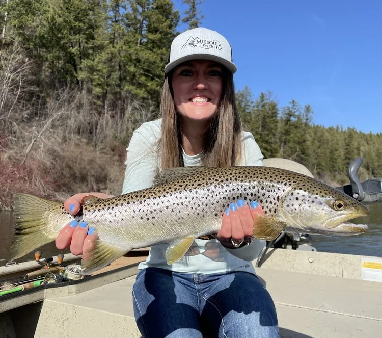 The+Lodge+at+Forest+Grove+_+Montana+Fly+Fishing+Lodge+_+woman+holding+large+brown+trout+on+Blackfoot+river.jpeg