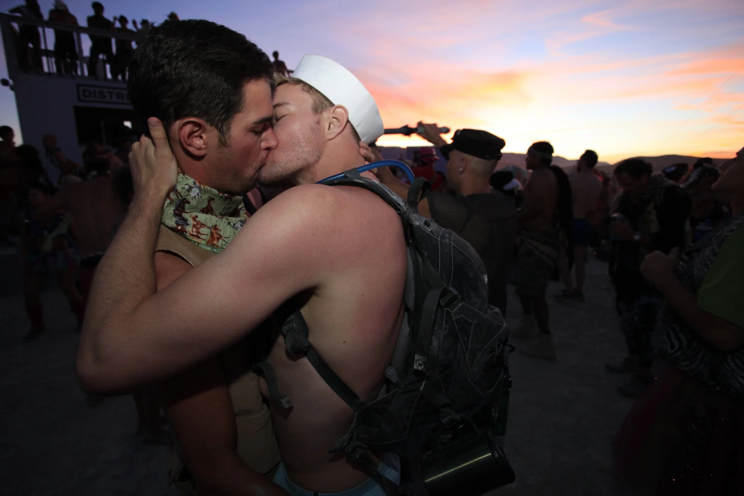 Burning Man 2010 156; Gay Sunset Kiss.JPG