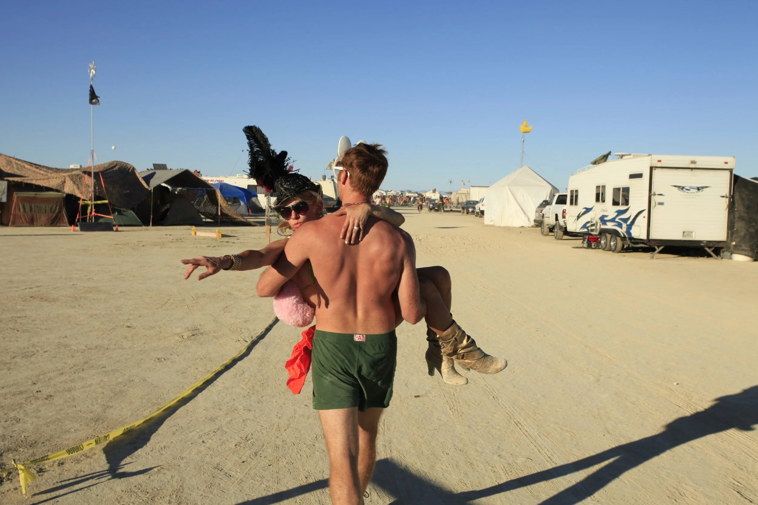 Burning Man 2010 306; Matt Carrying Girl Home.JPG