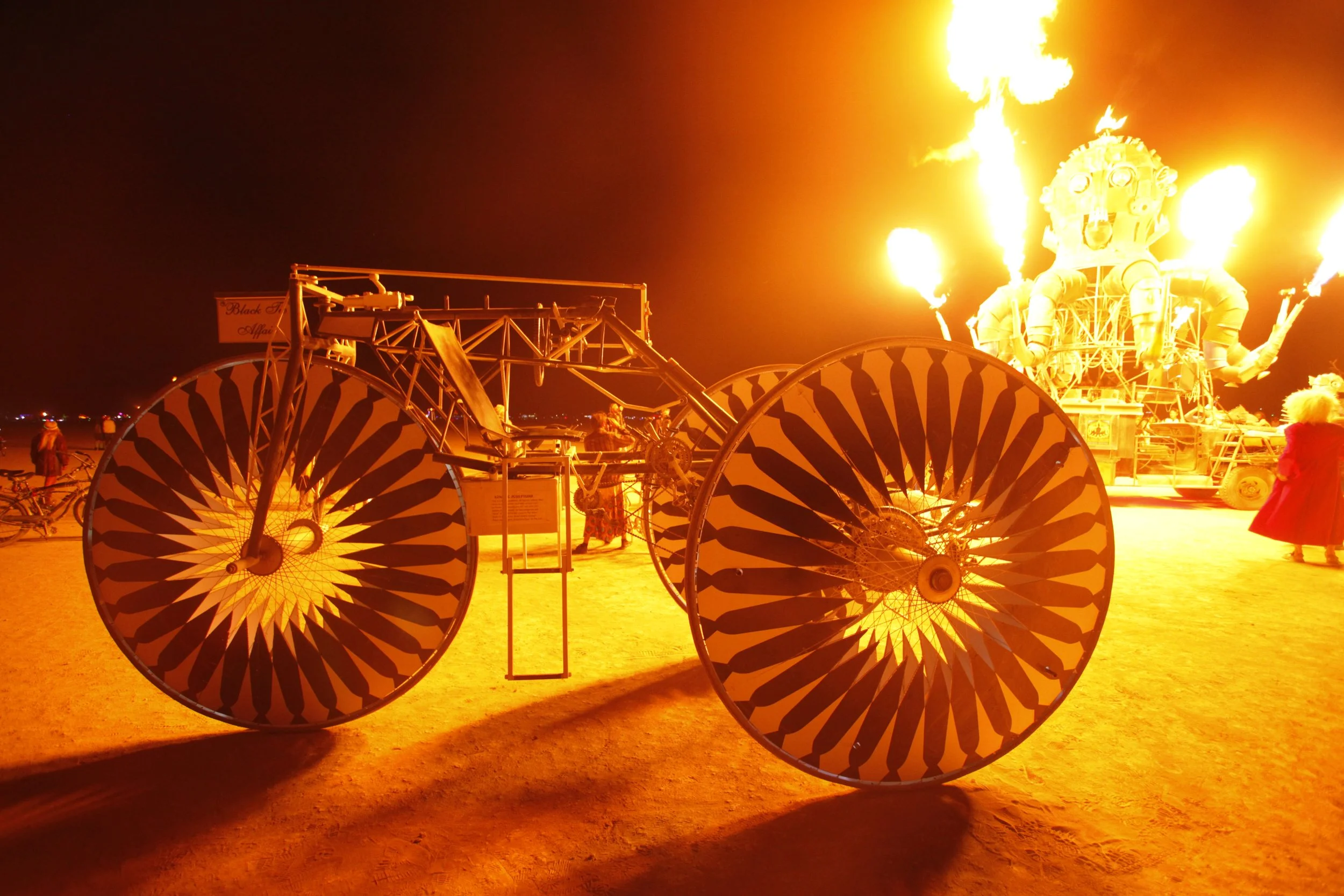 Burning Man 2011 239; Octopus Car Silhouetted Bike.JPG