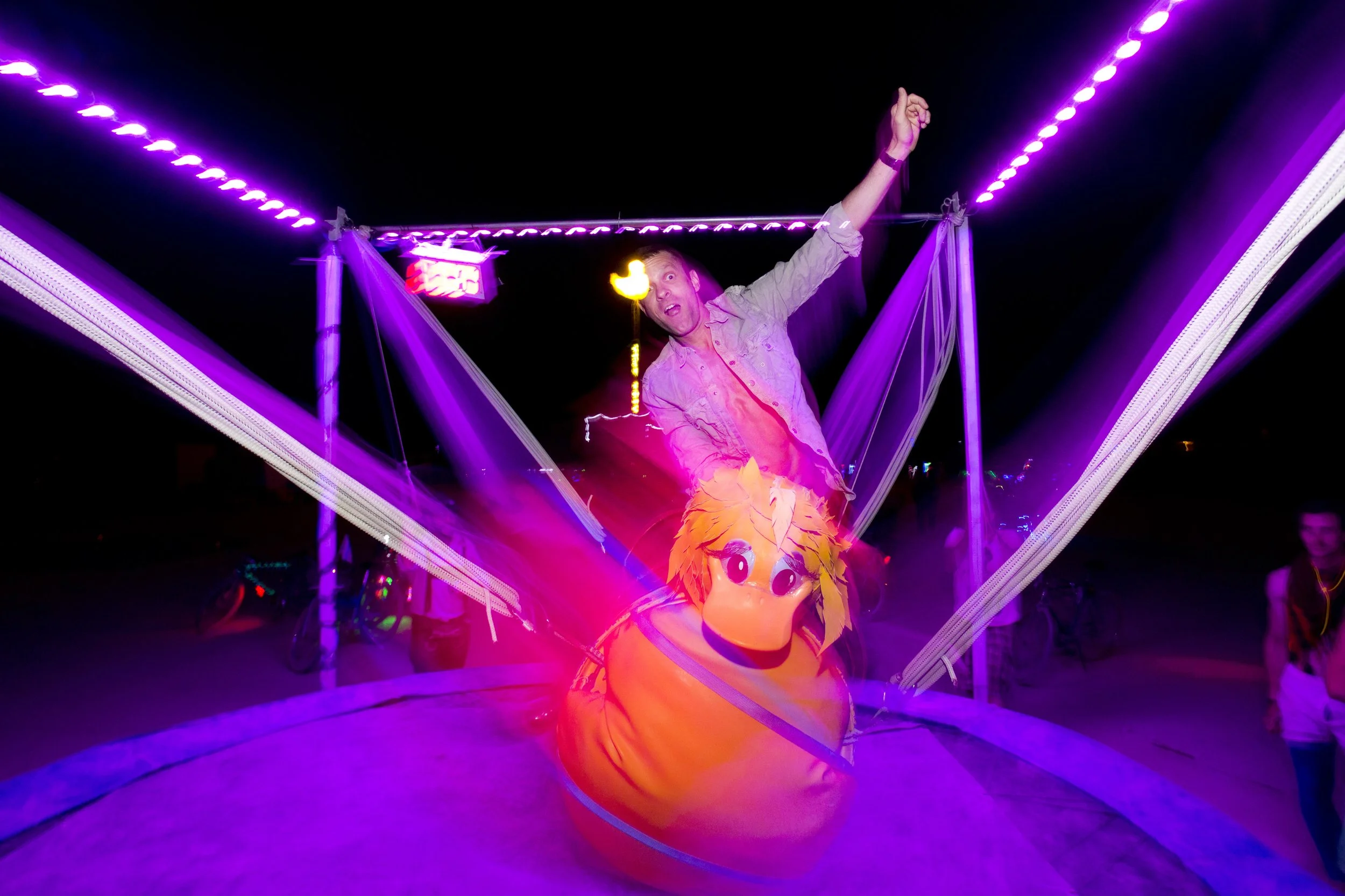 Burning Man 2013 110; Duck Pond Mechanical Bull Chris.JPG