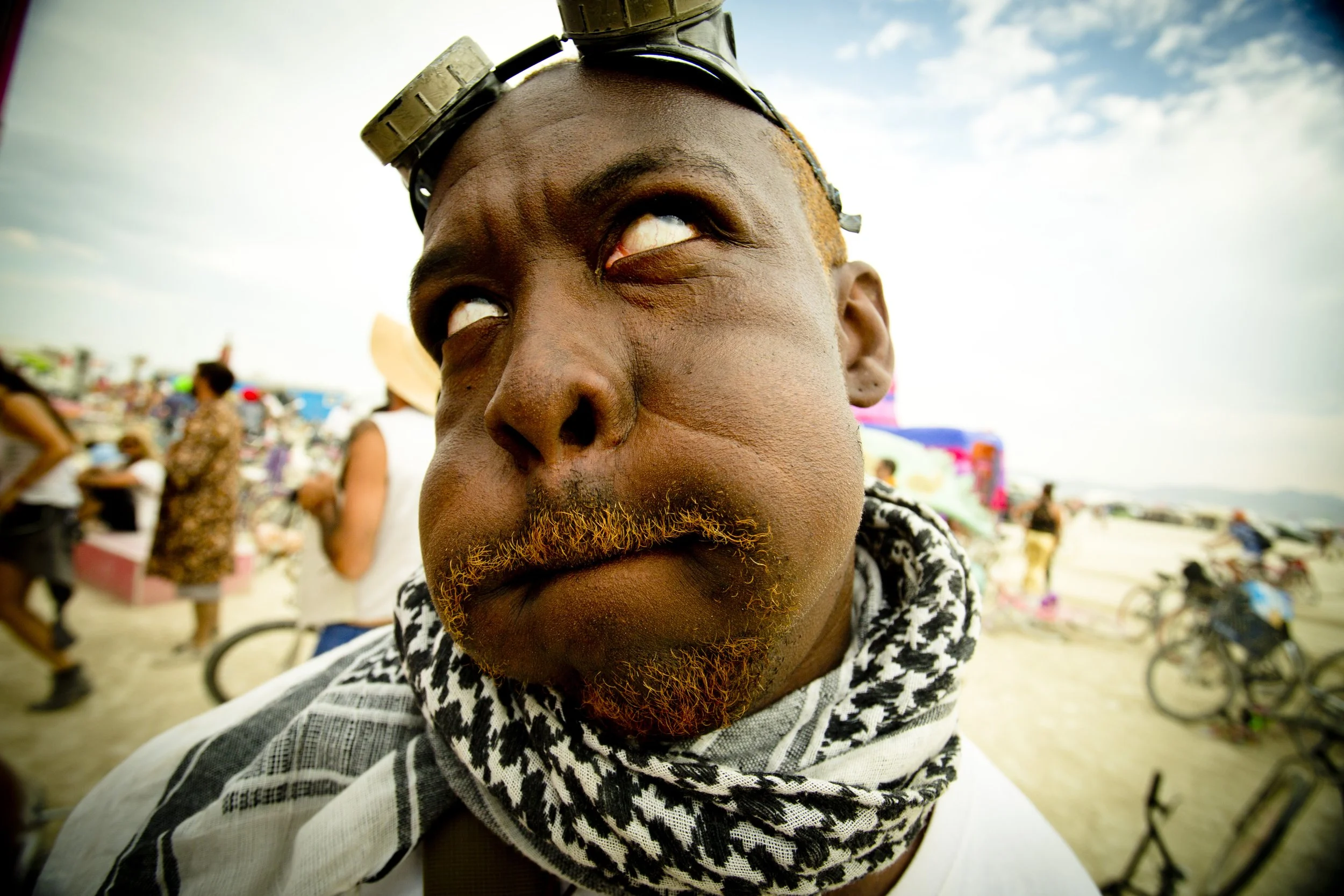 Burning Man 2013 333; African Guy Orange Bear Portrait Silly Face.JPG