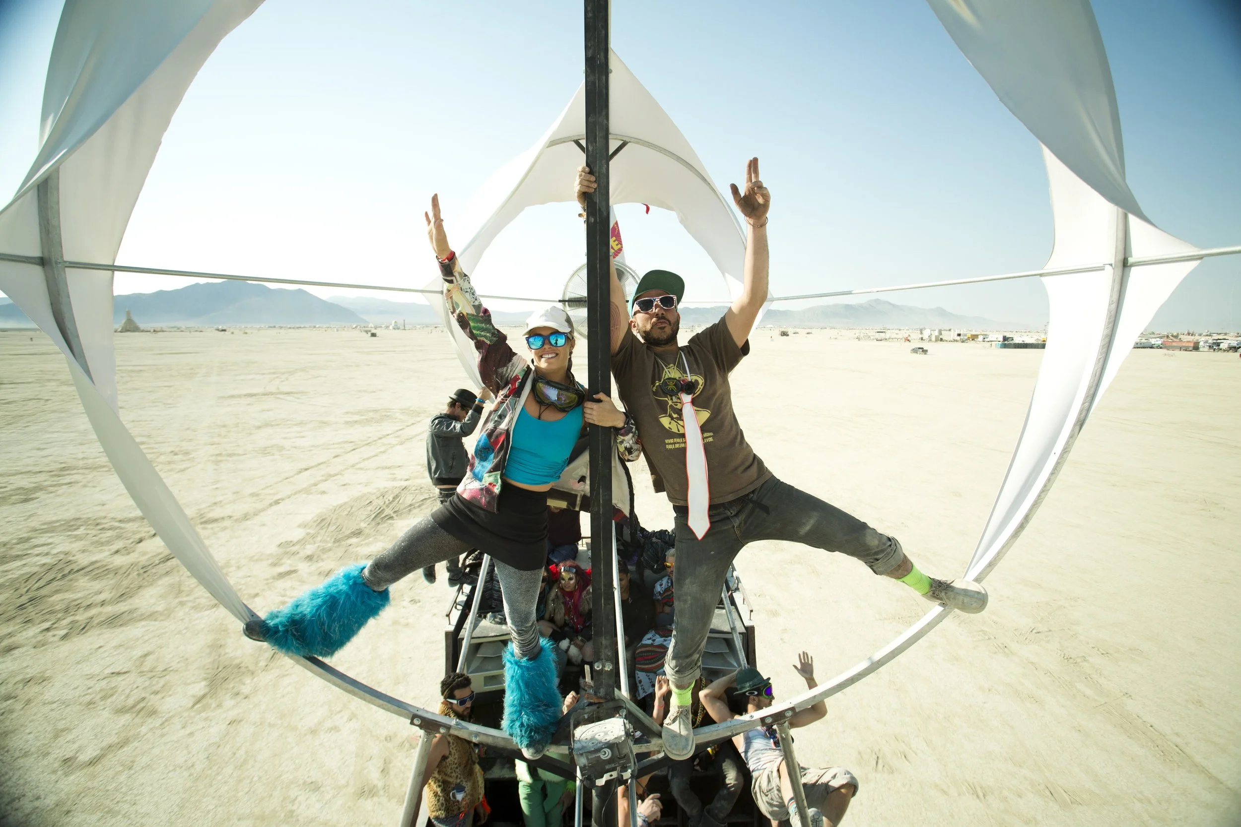 Burning Man 2014 89; Logan Baker Art Car Takeover Climbing.JPG