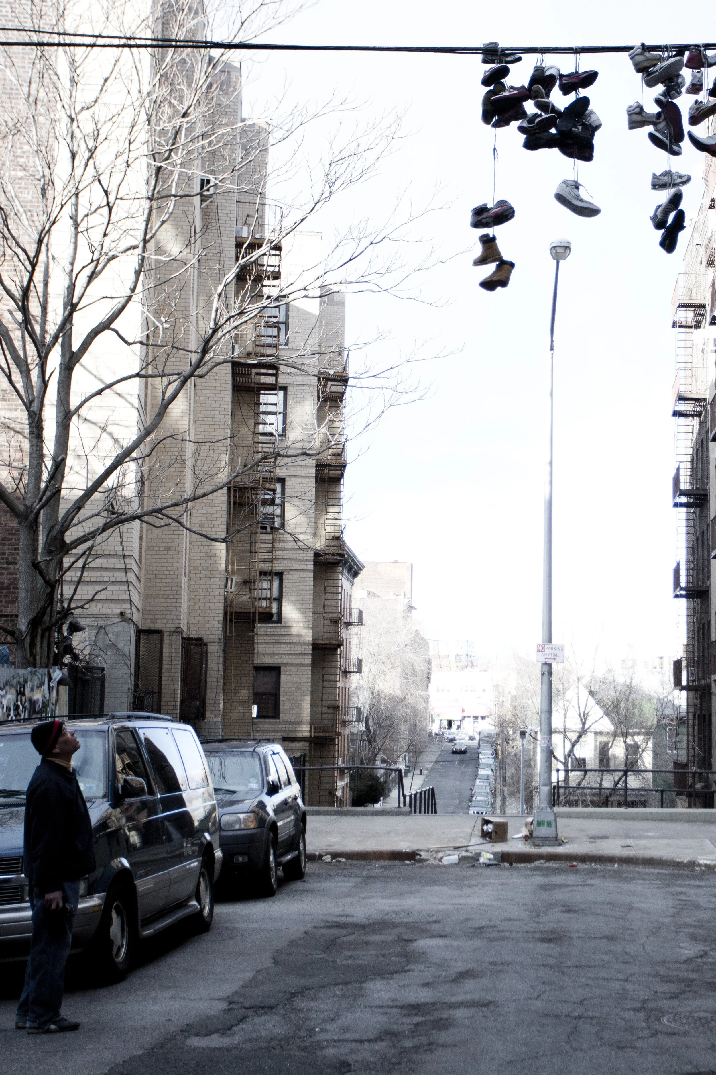 Bronx; Shoes On Telephone Wire Man Streets.JPG