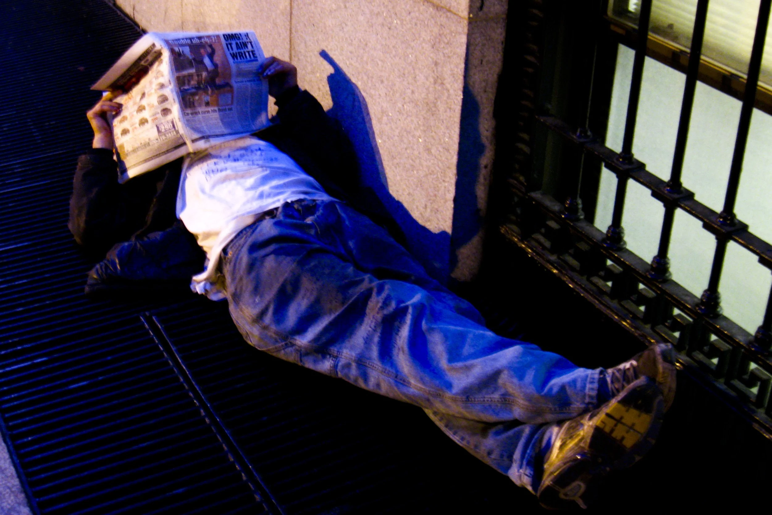 Homeless Guy Reading A Newspaper Streets Scrill Grills Sleeping Photo by Vito Fun.JPG