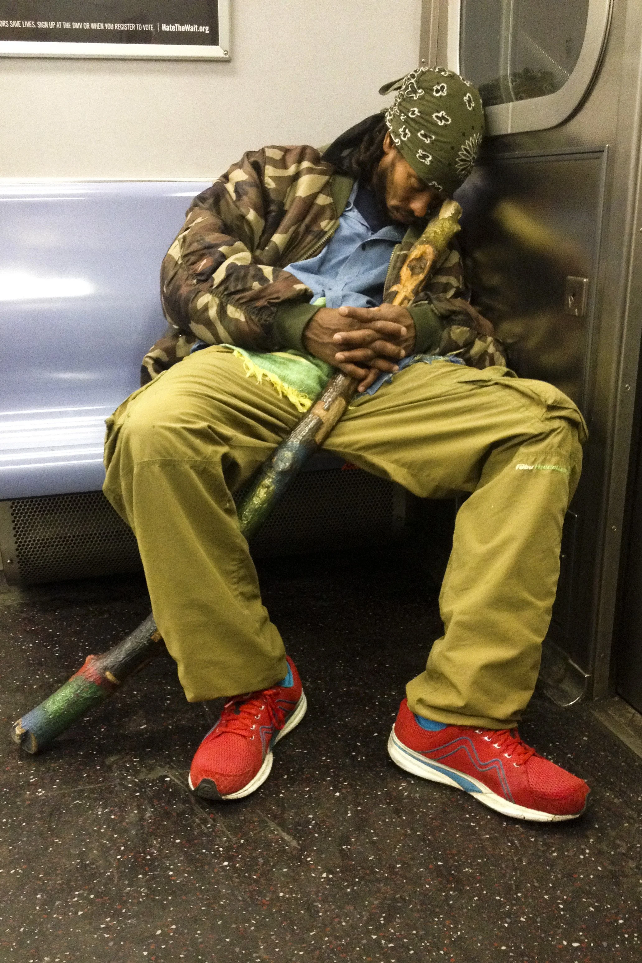 Sleeping Guy On Train With Staff.JPG