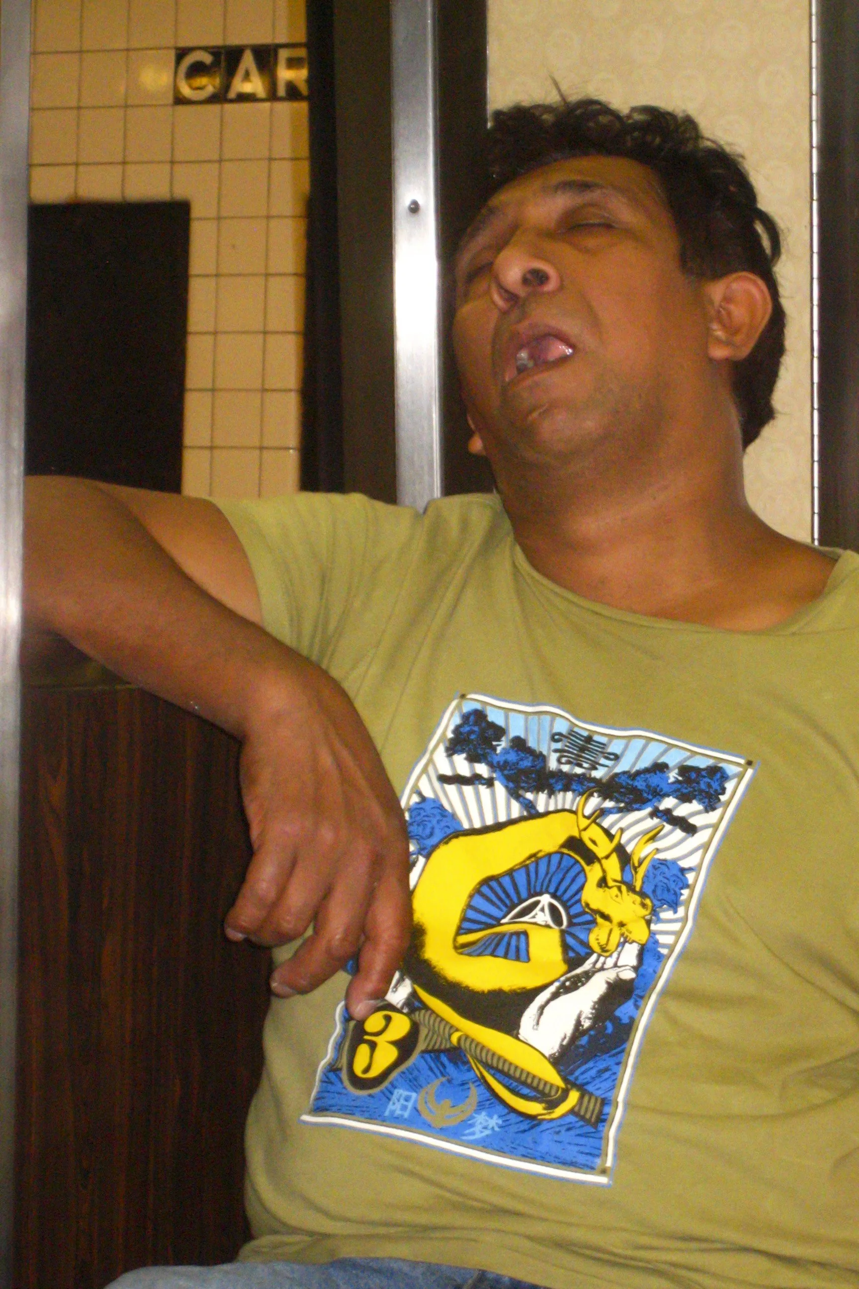 Sleeping Guy Train Scrill Grills.JPG