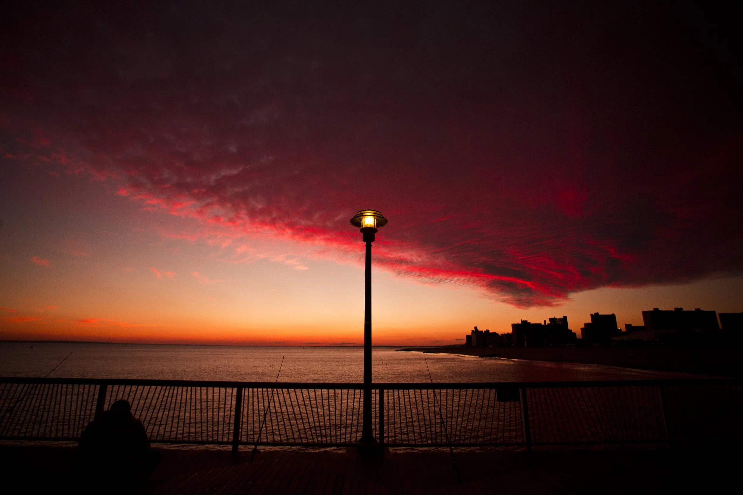 Coney Island Sunset; Pier Clouds Fisherman Silhouette Photo by Vito Fun.jpg