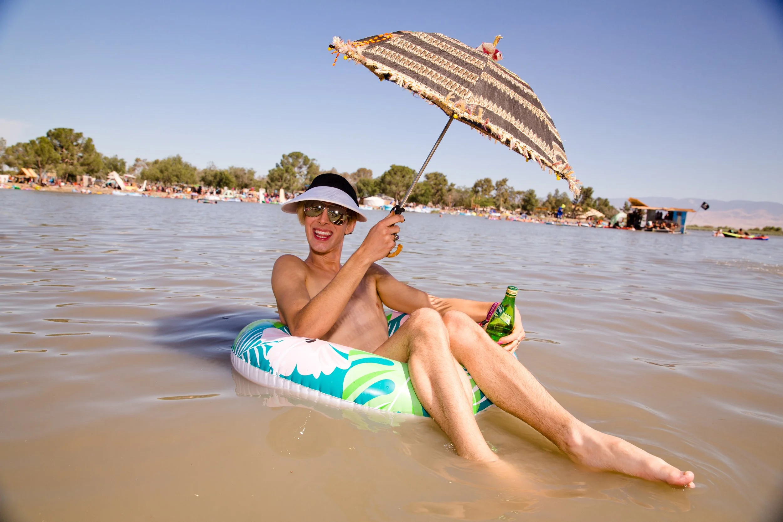 Lightning In A Bottle 2022 94; Unicorn Palace Boat Race Jace In Floatie Water Photo by Vito Fun.jpg