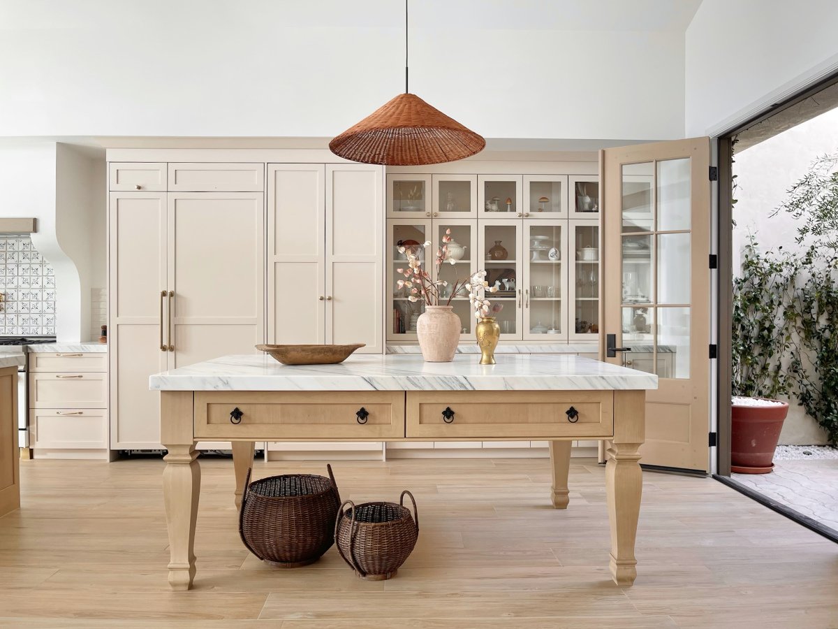Columbia Cabinets - European Frameless style kitchen. deVol style. Island with decorative legs. Antique white cabinets. Glass door cabinets.