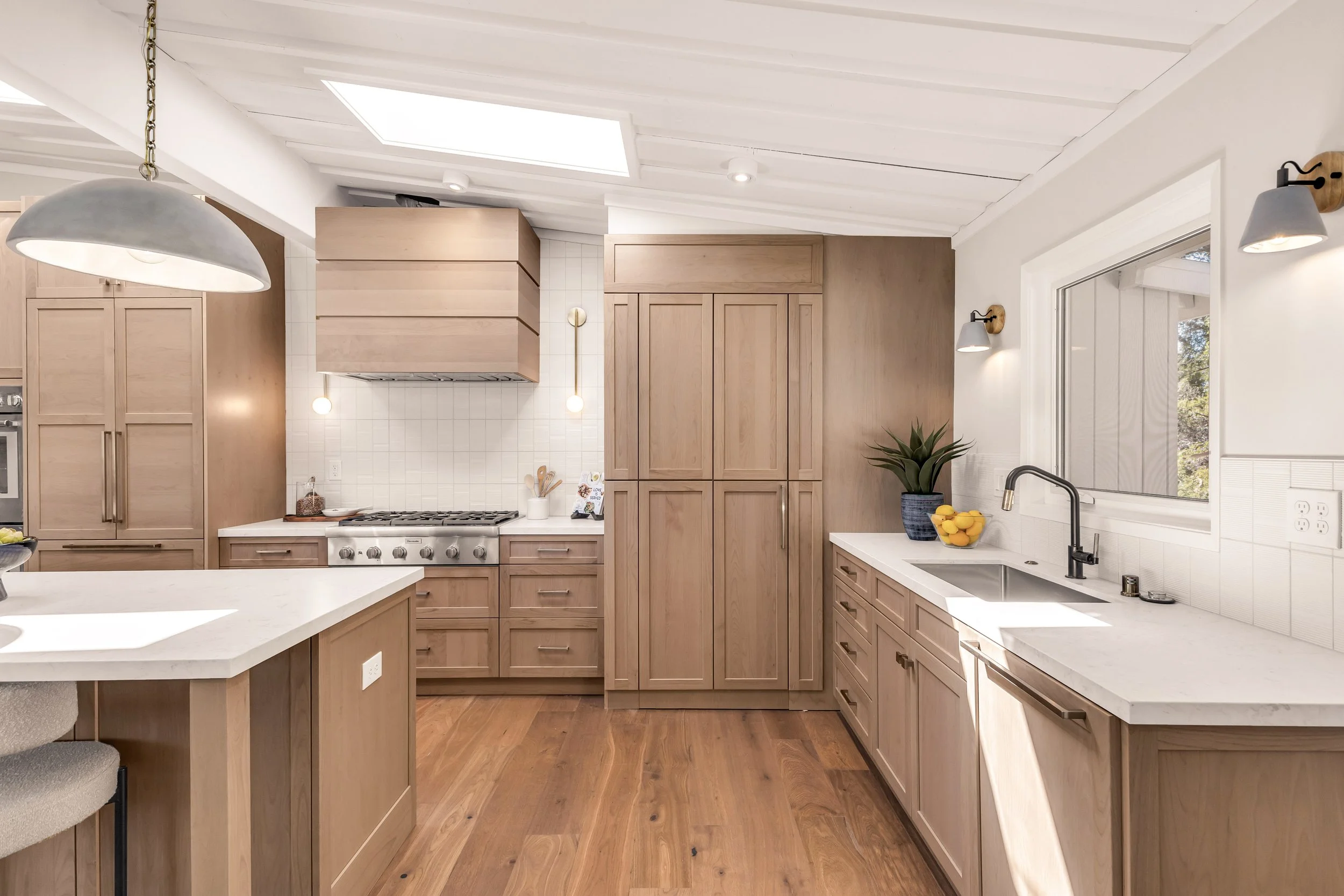 Hidden walk-in pantry with floor-to-ceiling custom cabinetry in an award-winning Orinda kitchen.