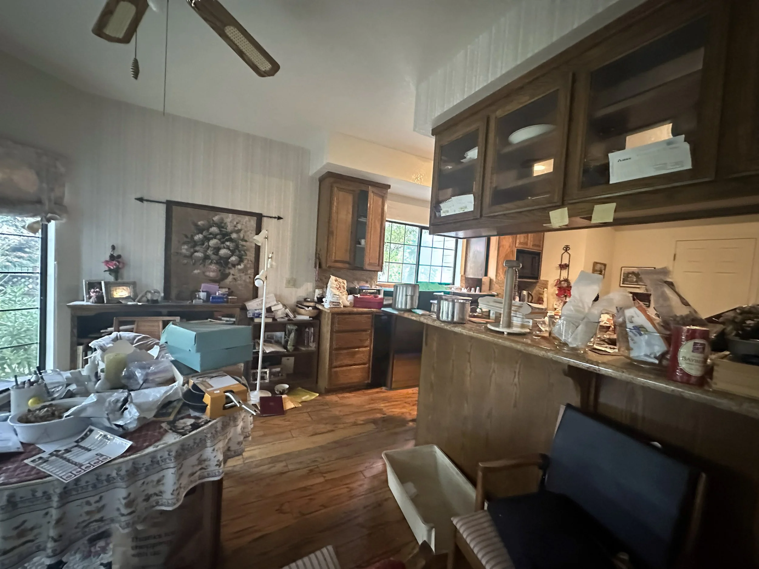 Blackhawk kitchen before pictures of cluttered, dark, closed-in kitchen with heavy oak cabinetry.