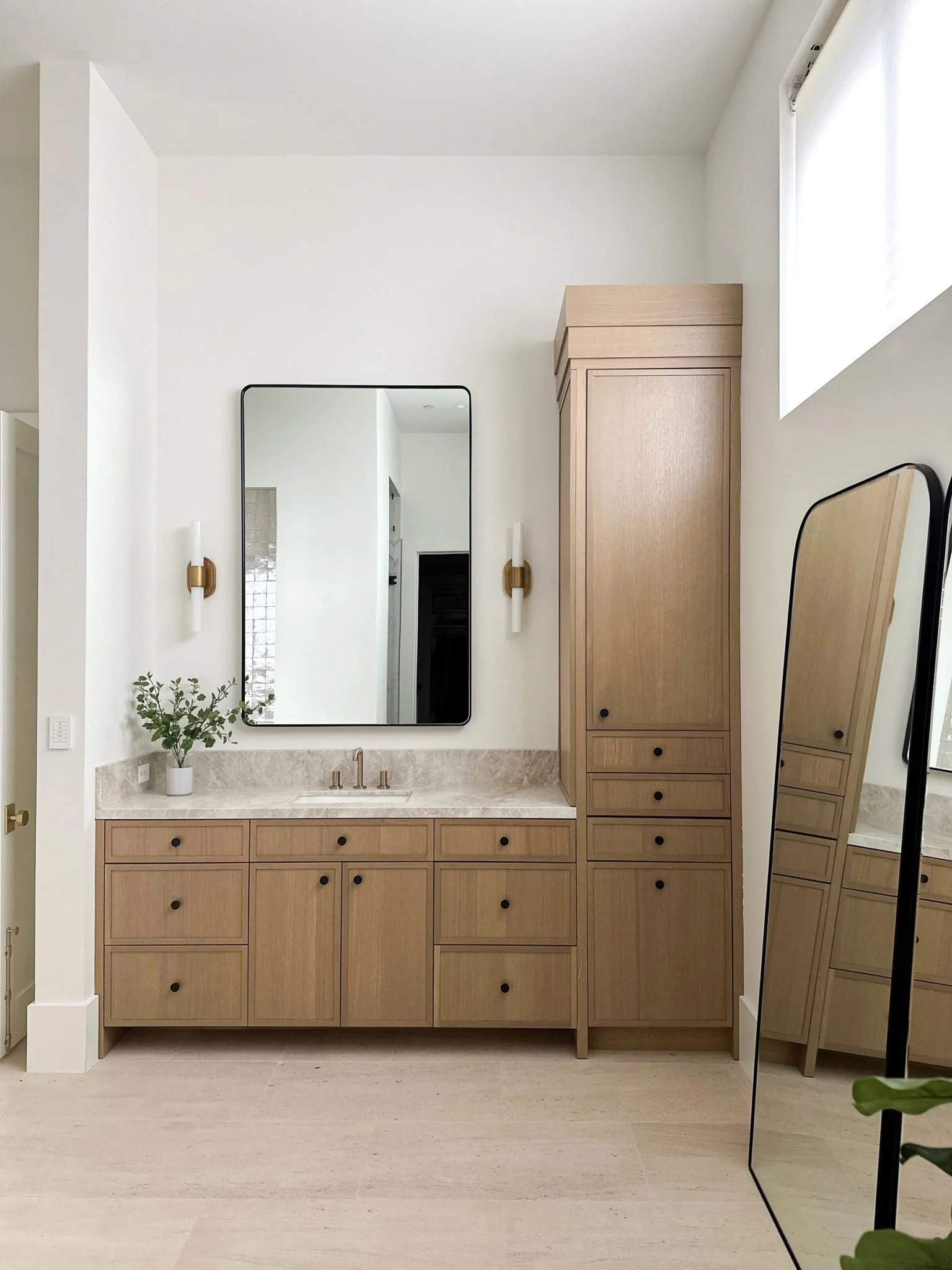 Columbia Cabinets - Bathroom built-ins. Natural wood cabinets. Frameless. Tall linen closet cabinet.