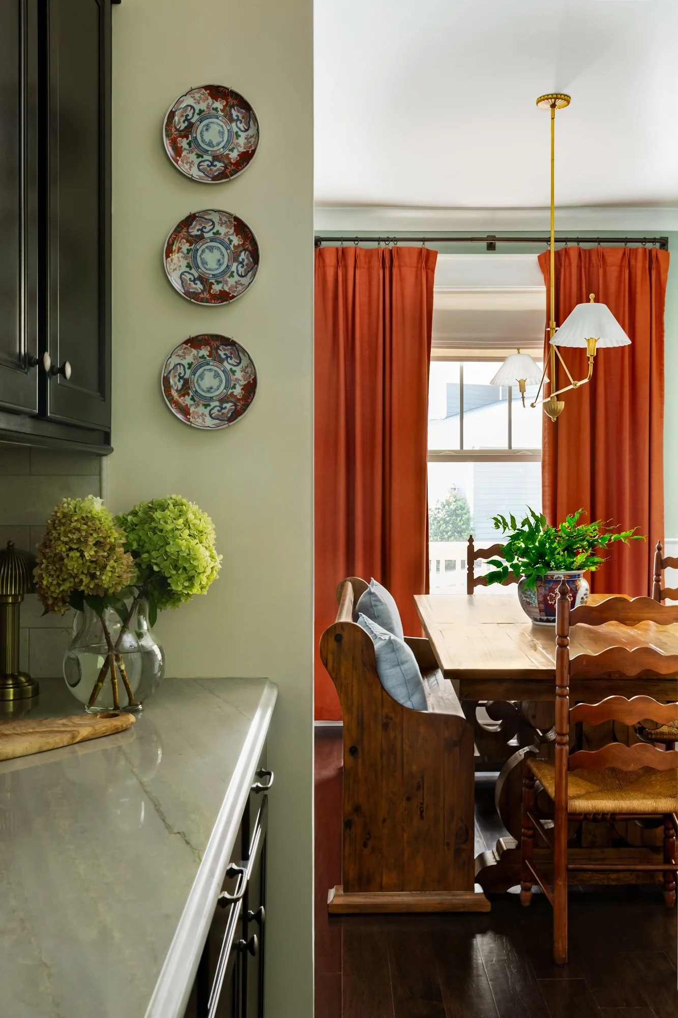 Timeless dining room designed by Emily Rebecca Design featuring warm materials and layered textures in a Greenville, South Carolina home.