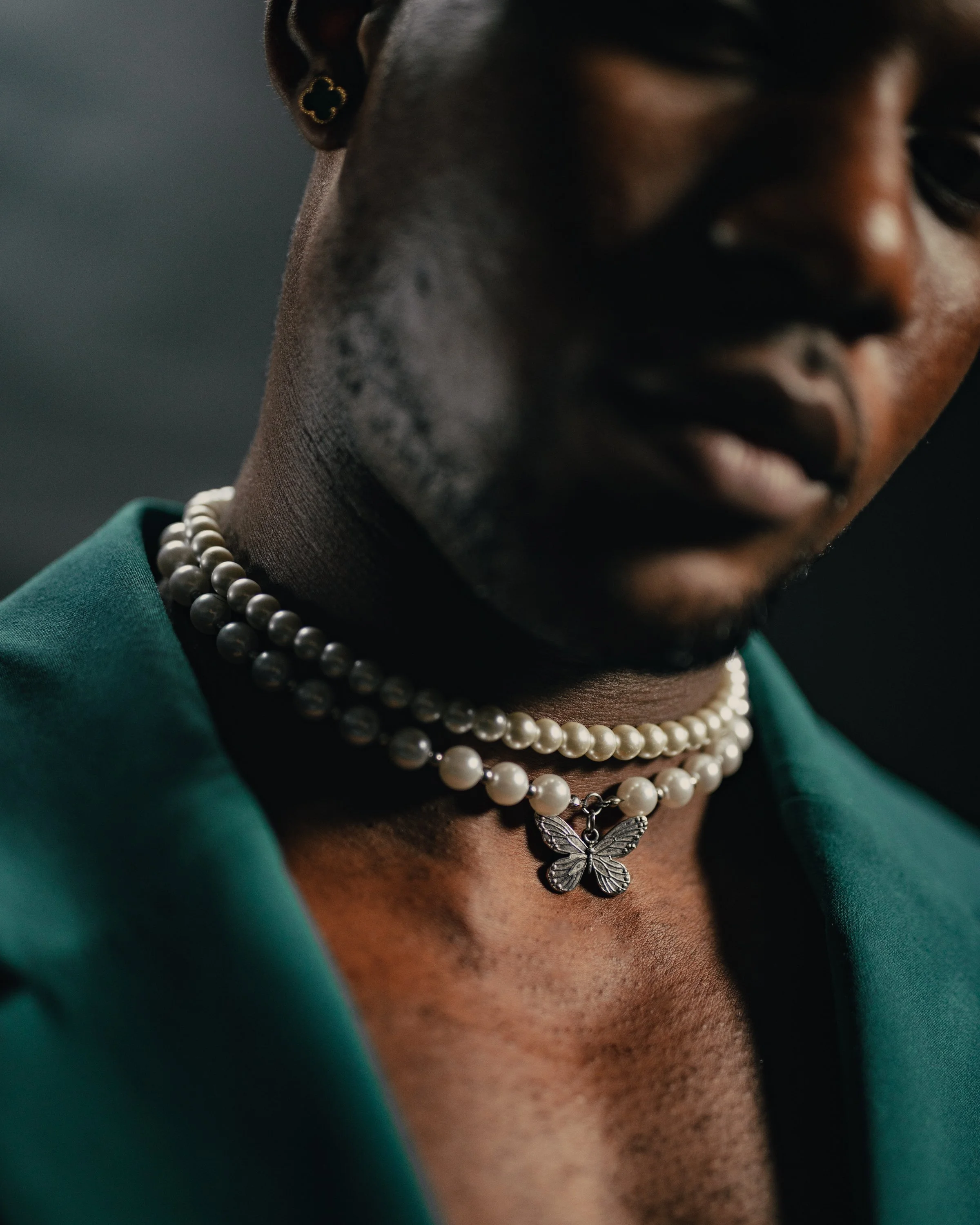 Fashion photography of black male model wearing a green suit in Cape Town, South Africa by photographer Vanartist