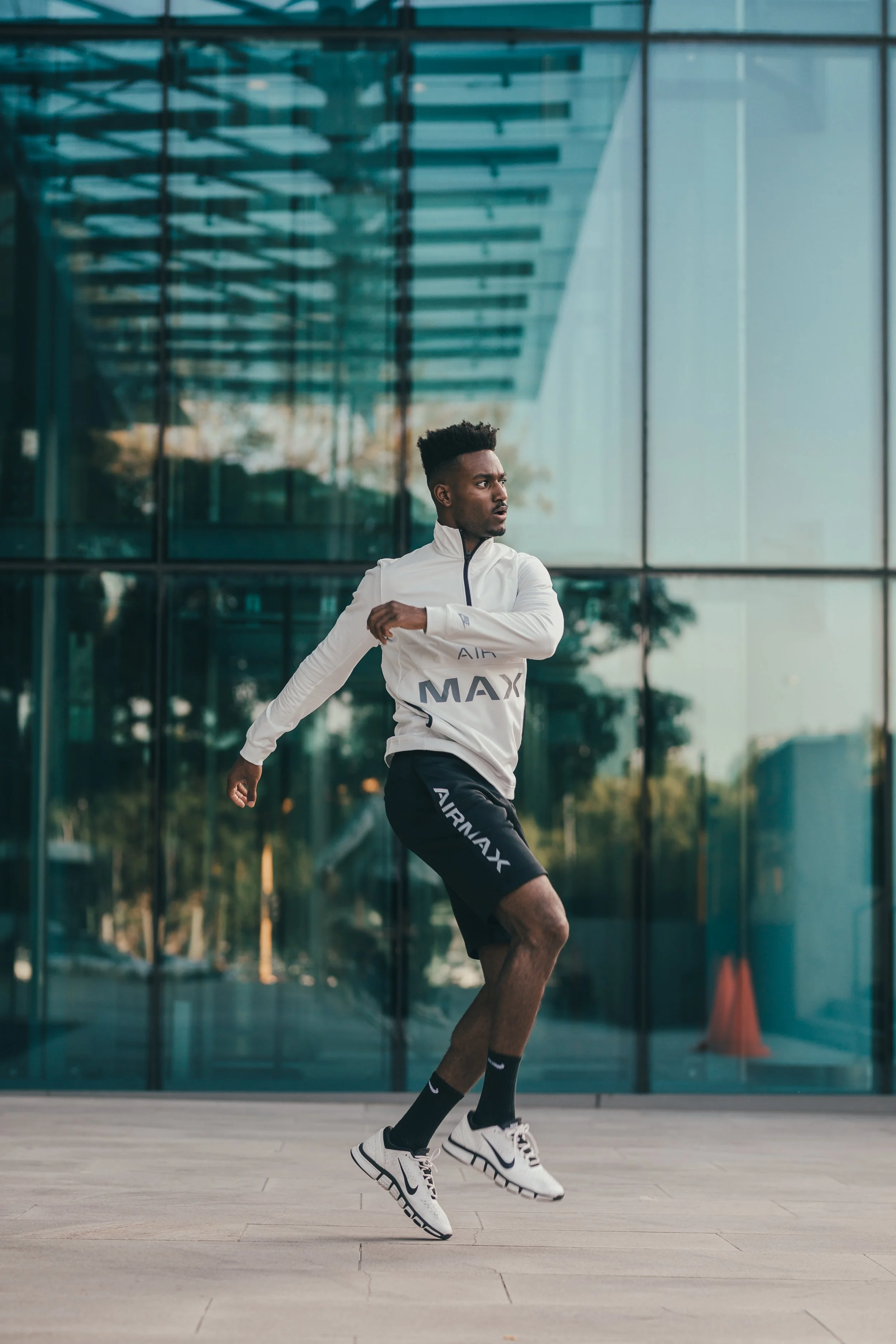 Lifestyle photography of black male model wearing Nike in Cape Town, South Africa by photographer Vanartist