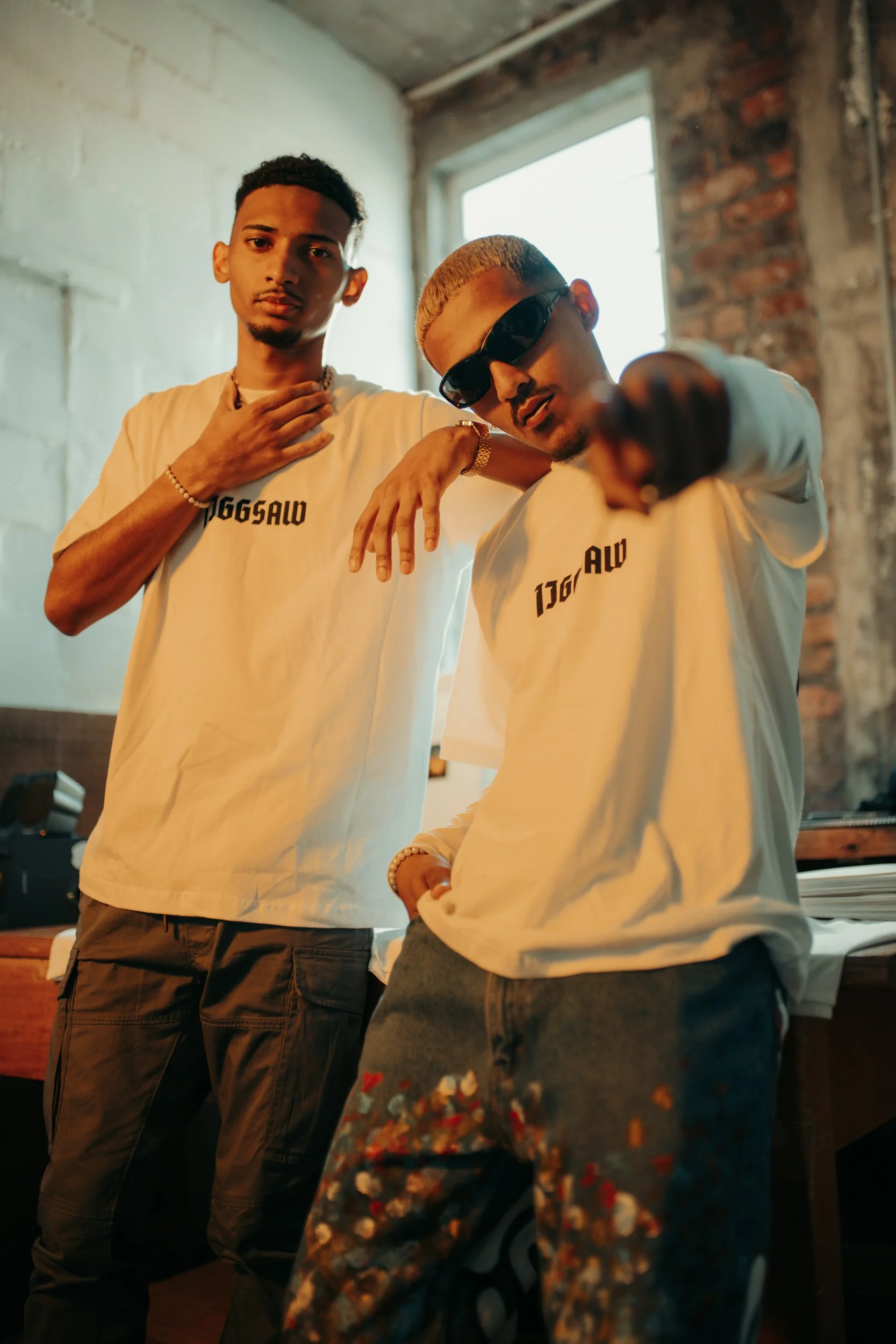Fashion photography for Jiggsaw Apparel of two young models wearing a t-shirt and sunglasses in Cape Town, South Africa by photographer Vanartist