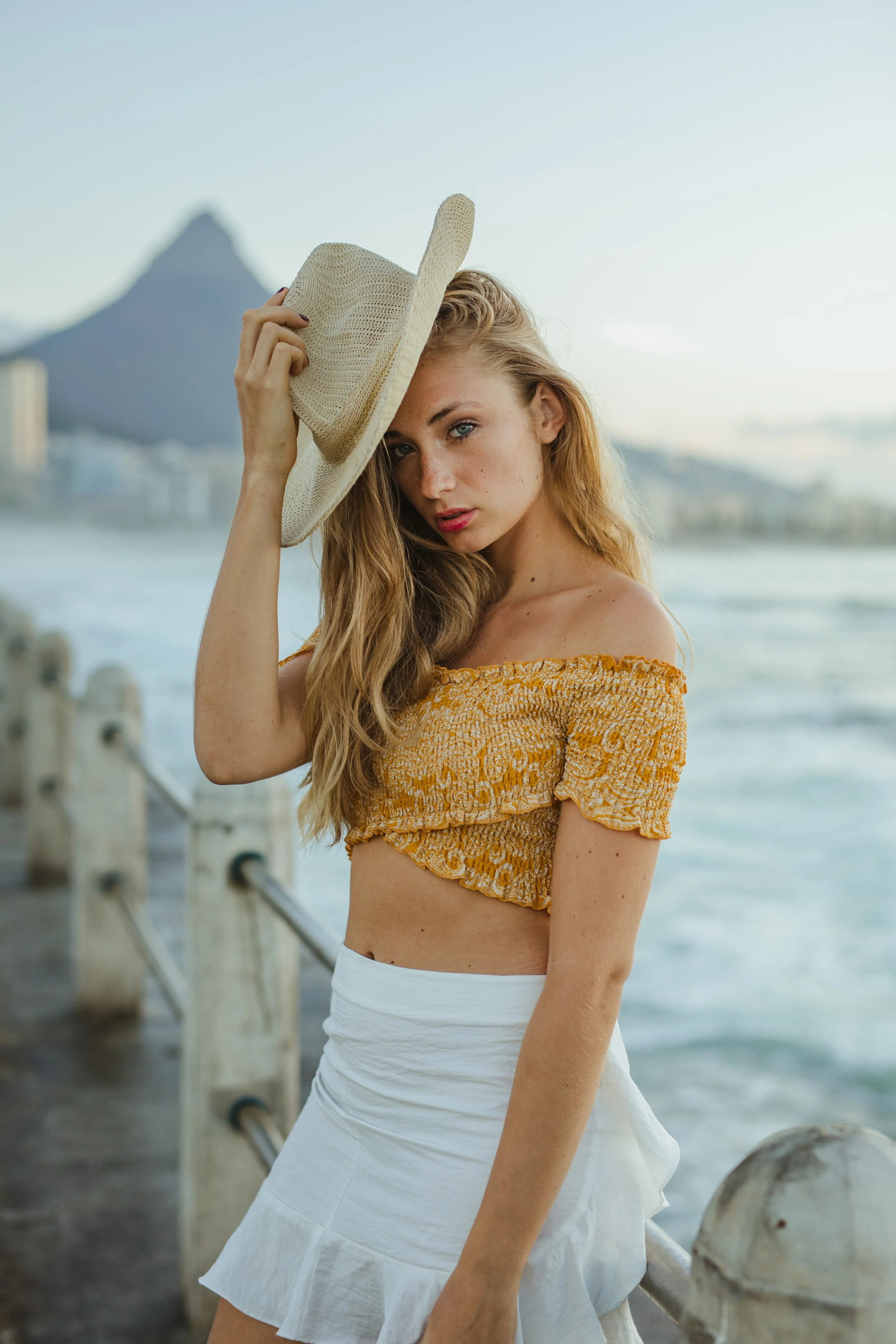 Lifestyle photography of blonde model with a hat in Cape Town, South Africa by photographer Vanartist