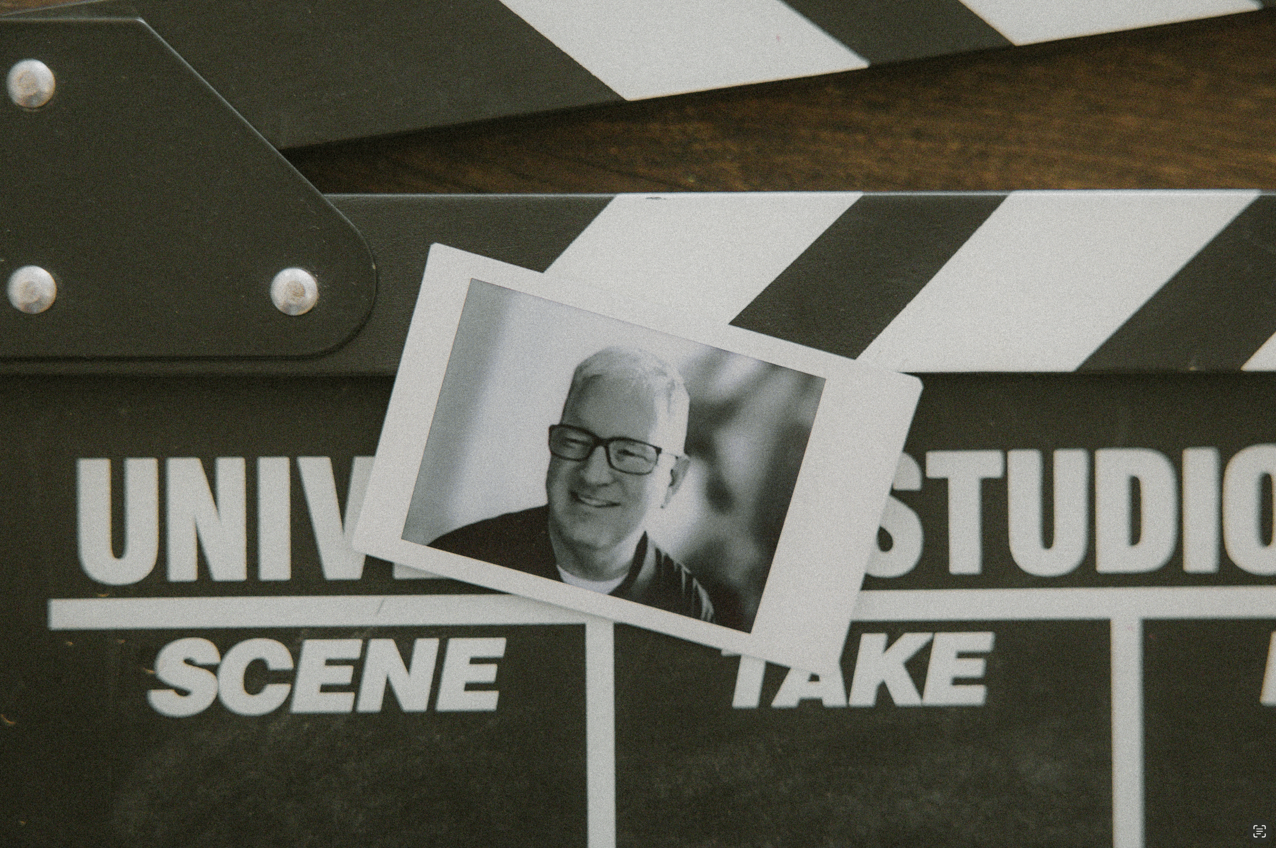 black and white polaroid of a photographer smiling