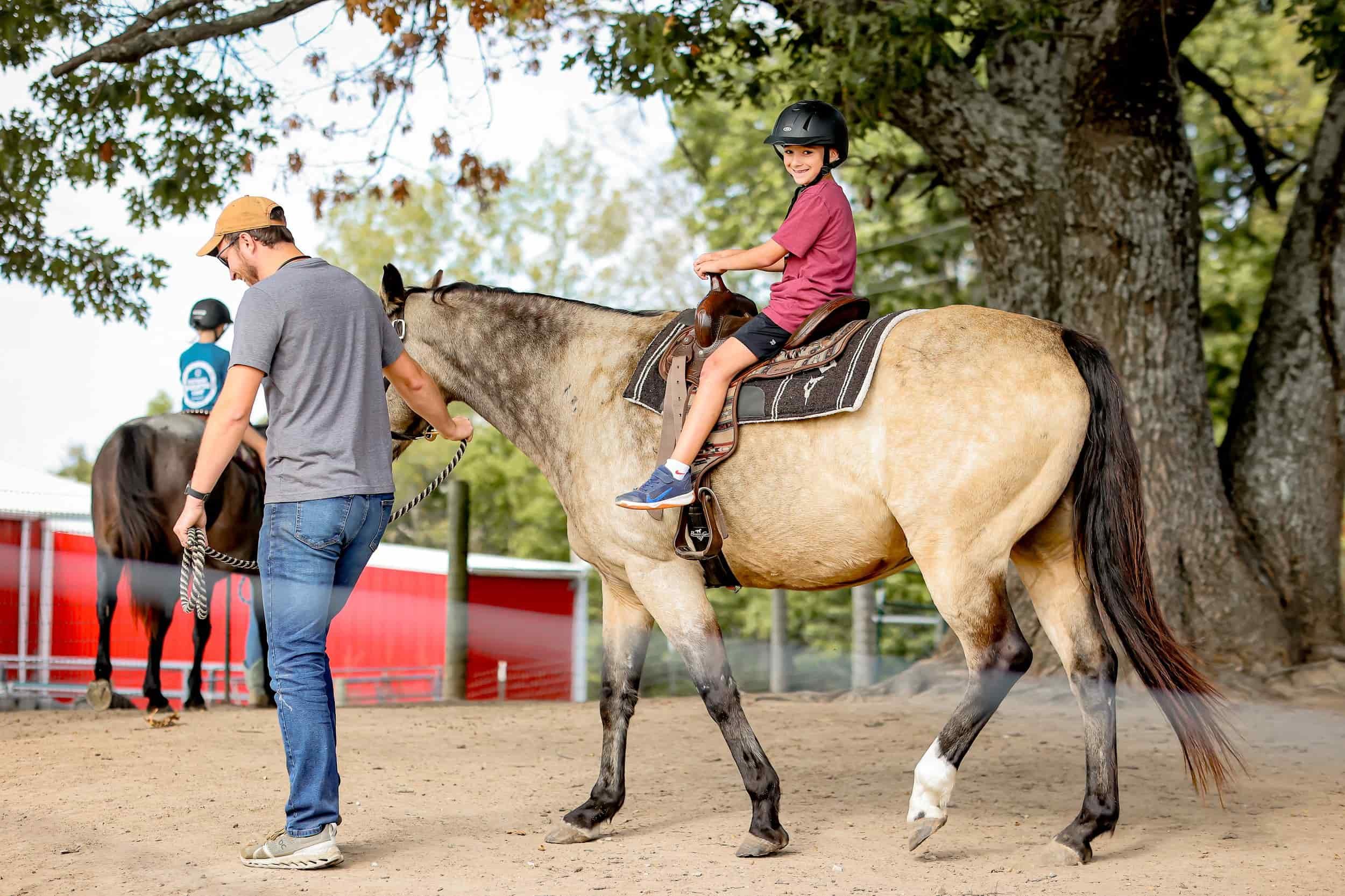 Children in foster care participating in outdoor adventure activities at Joy Meadows nature camp near Kansas City