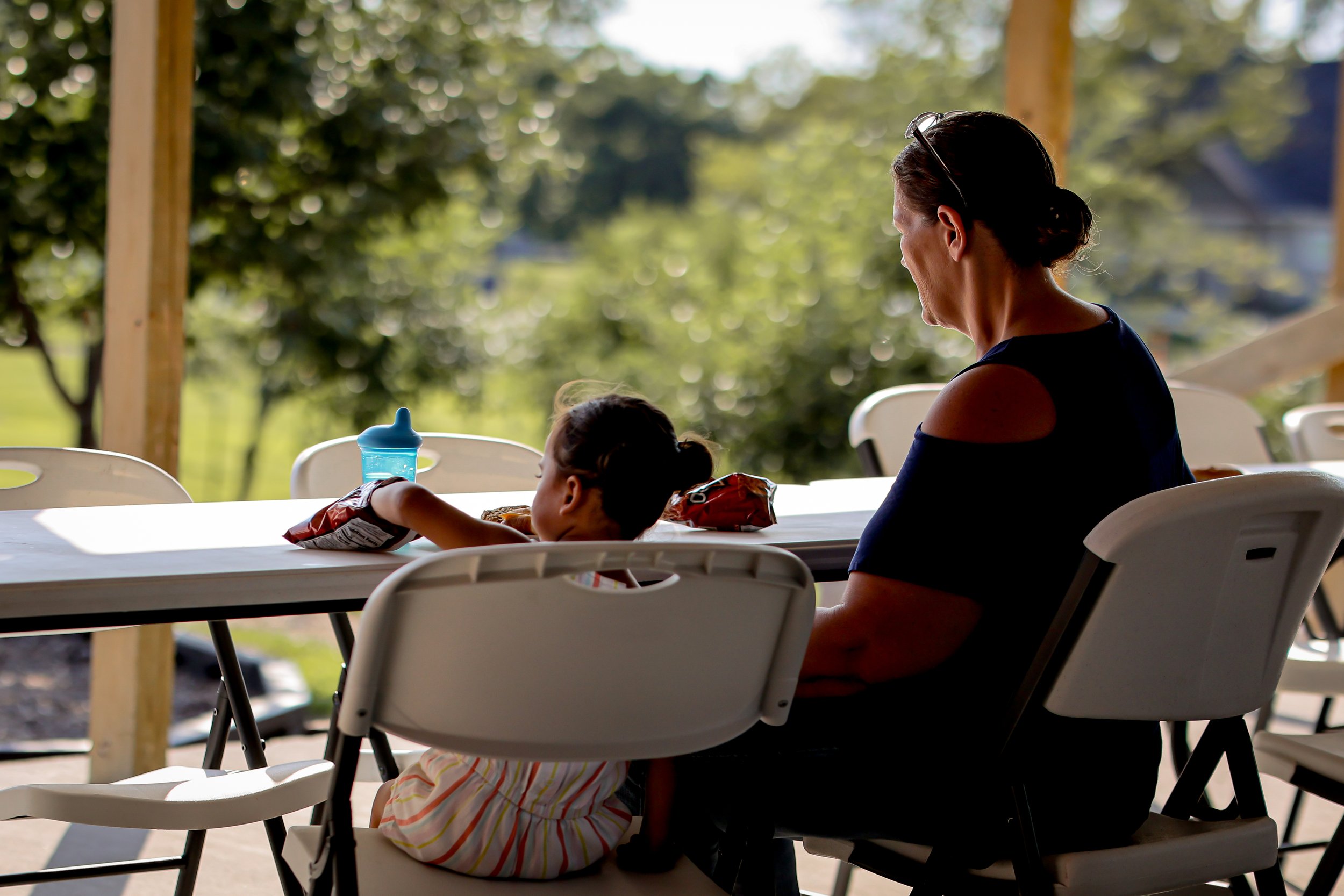 Young child in foster care looking hopeful outdoors at Joy Meadows in Linwood, Kansas