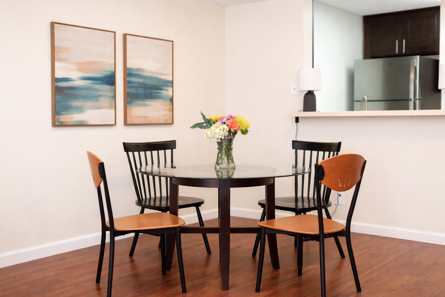 Bright dining space with floral centerpiece.png