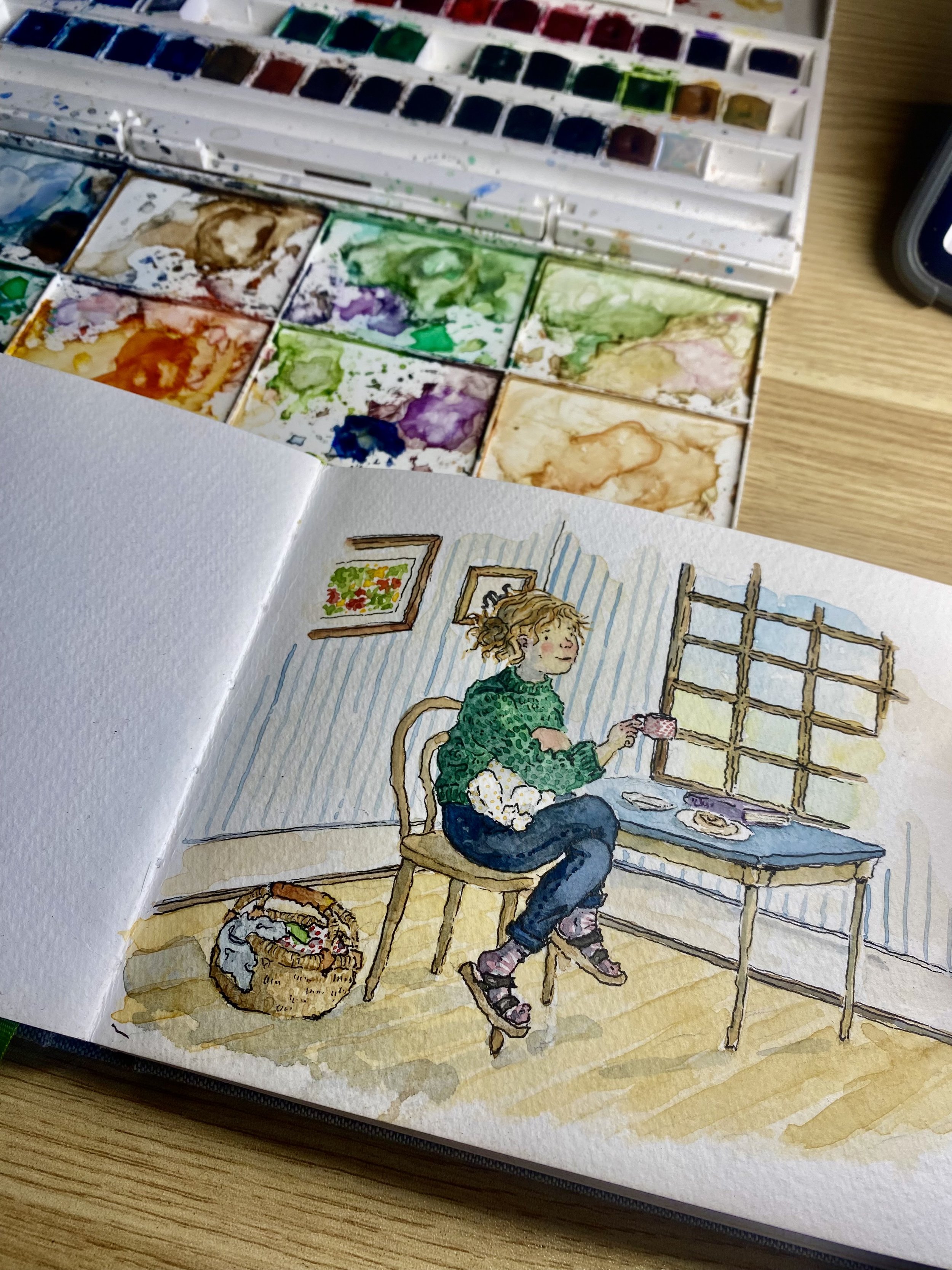 A watercolor illustration of a girl with curly blond hair, wearing a green sweater and roller skates, sitting at a table with a plate of food, holding a cup of tea, in a cozy room with striped wallpaper, a window, and a framed picture on the wall, with a basket of yarn and knitting supplies on the floor nearby.