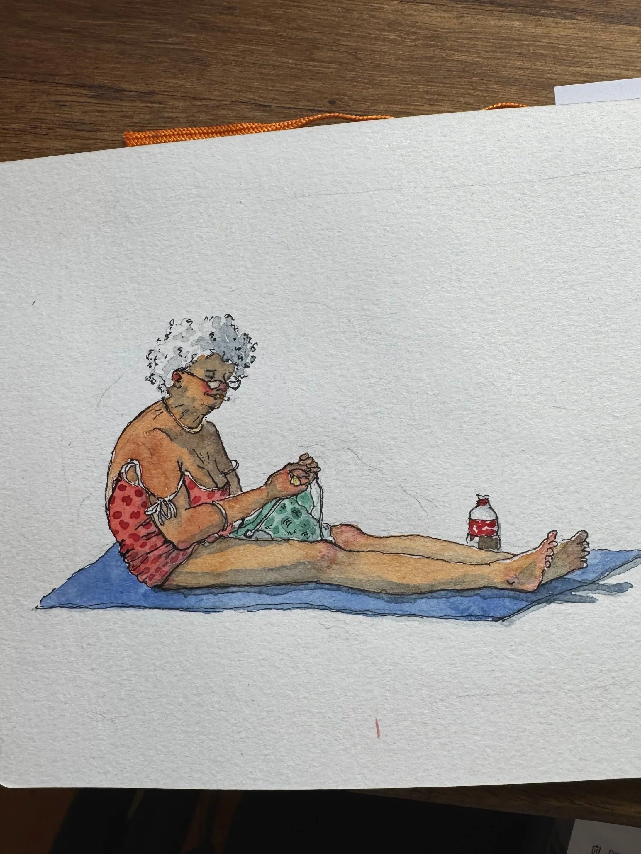 A watercolor illustration of an elderly woman with curly gray hair, wearing glasses and a red polka-dotted sundress, sitting on a blue mat. She is knitting or crocheting with a ball of yarn, with a bottle placed beside her.