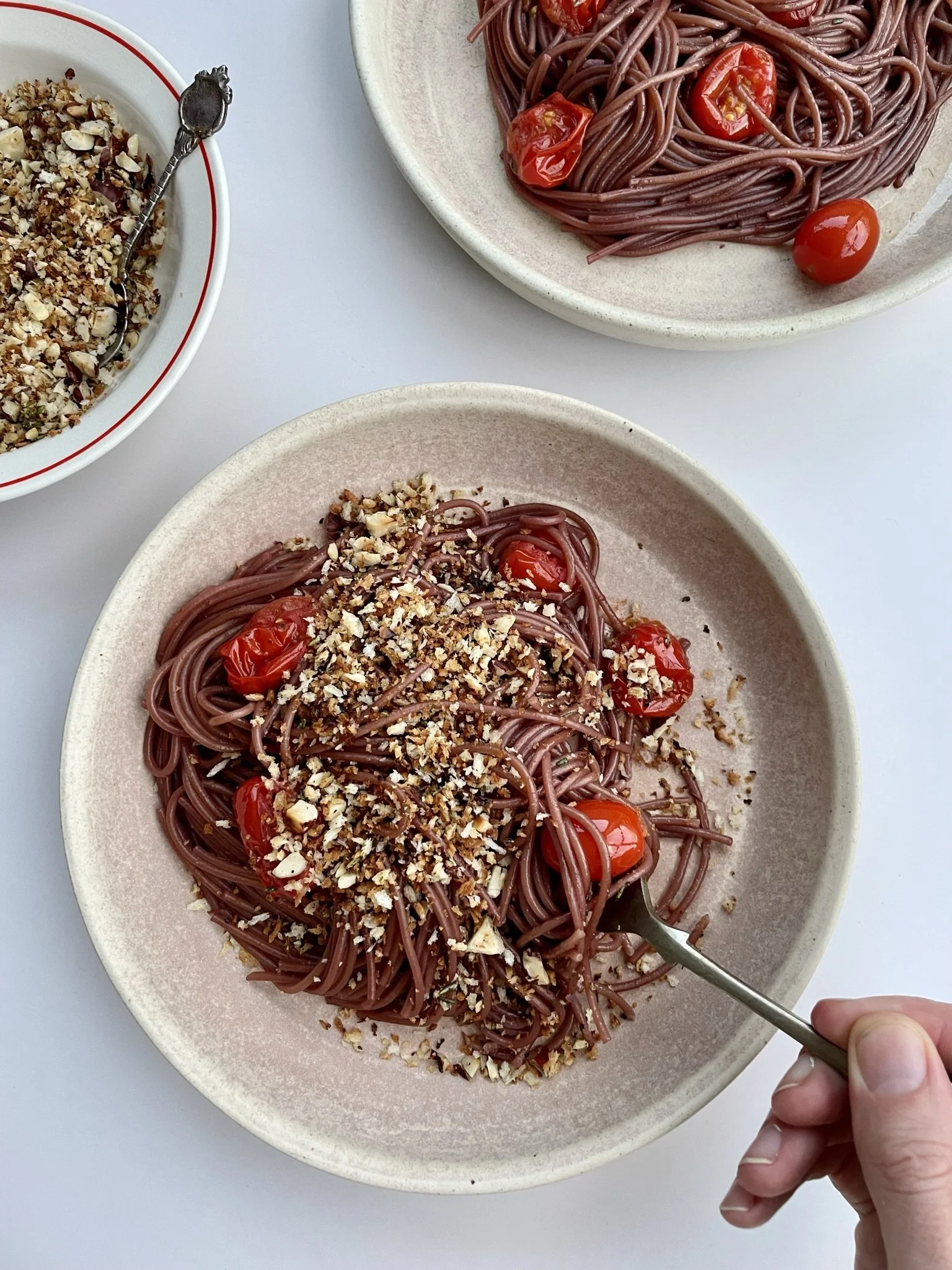 Spaghetti all'Ubriaco with hazelnut-rosemary crumbs
