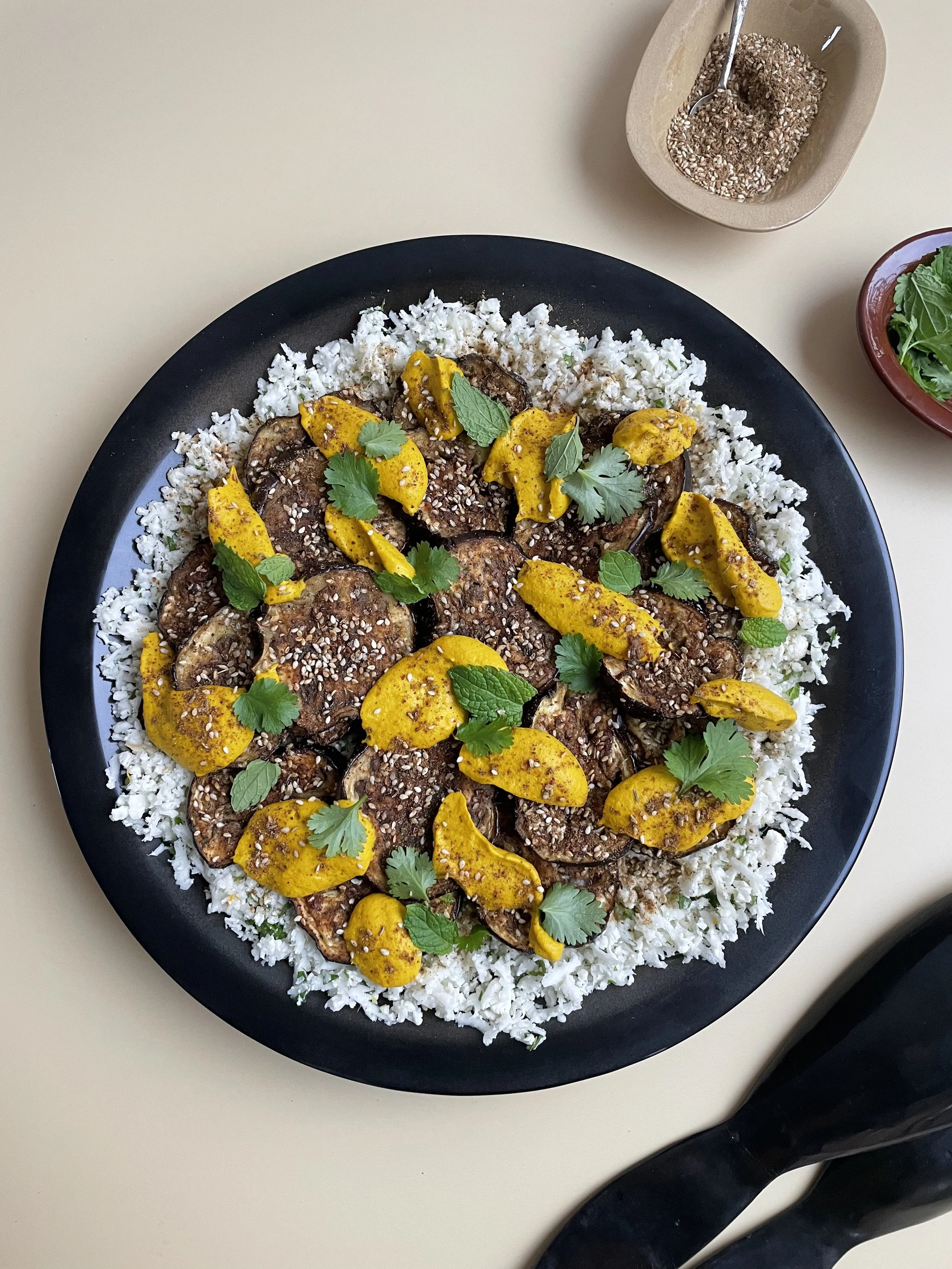 Za'atar aubergines with herby cauli rice and roasted carrot whip