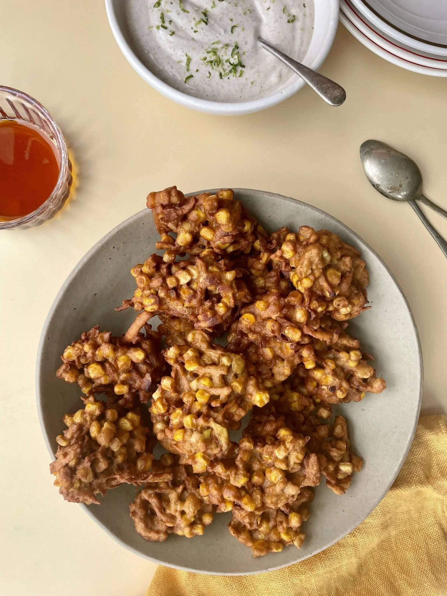 Spiced sweetcorn + apple fritters with maple-lime tahini yoghurt
