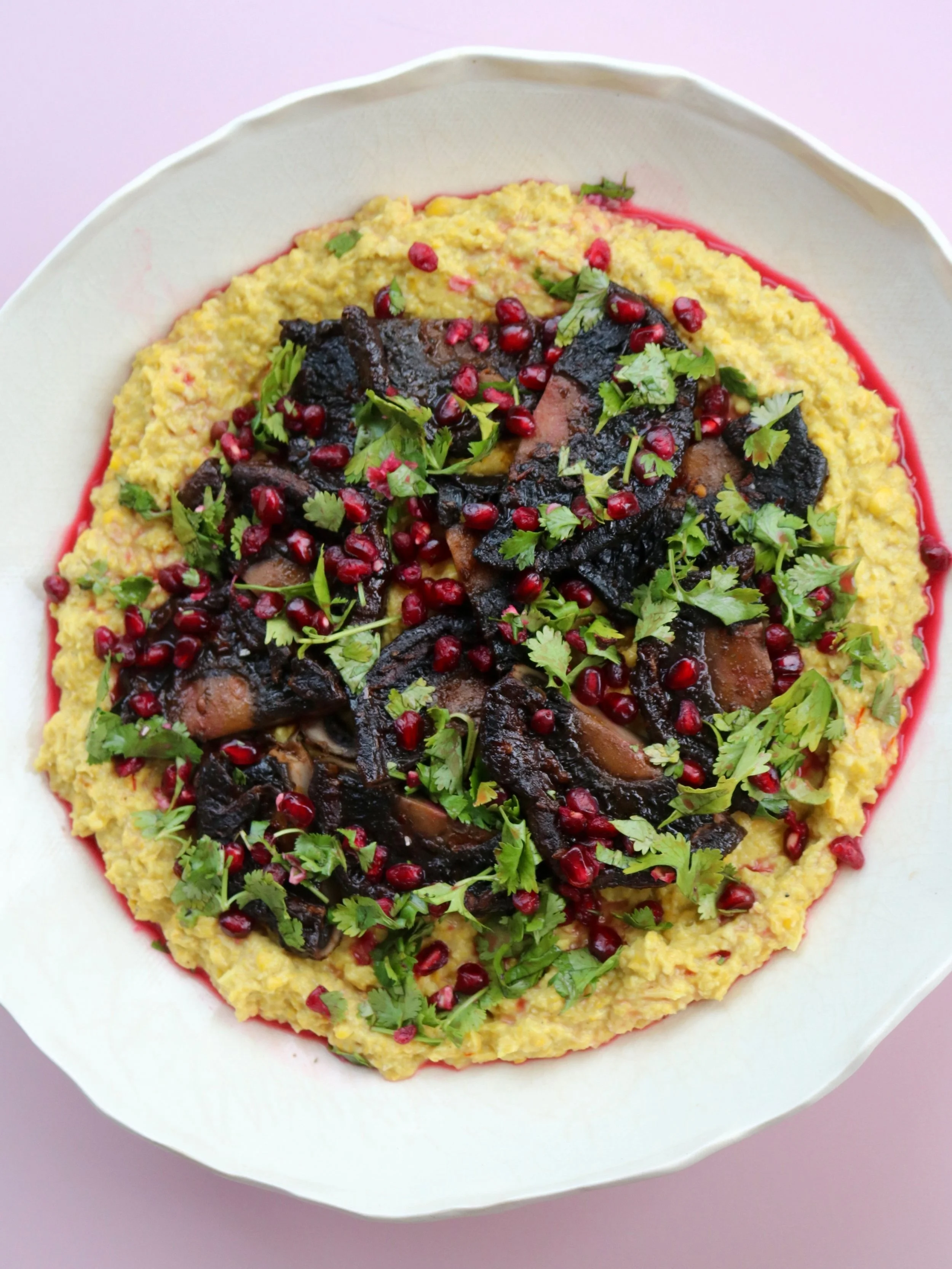 Harissa portobello steaks with saffron sweetcorn purée and pomegranate