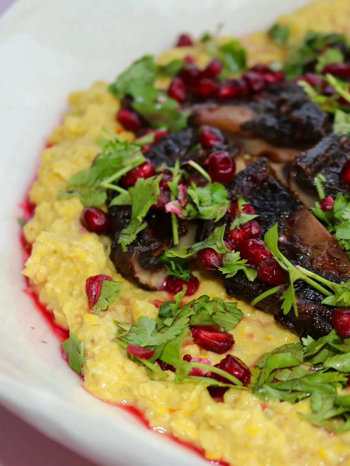 Harissa portobello steaks with saffron sweetcorn purée and pomegranate